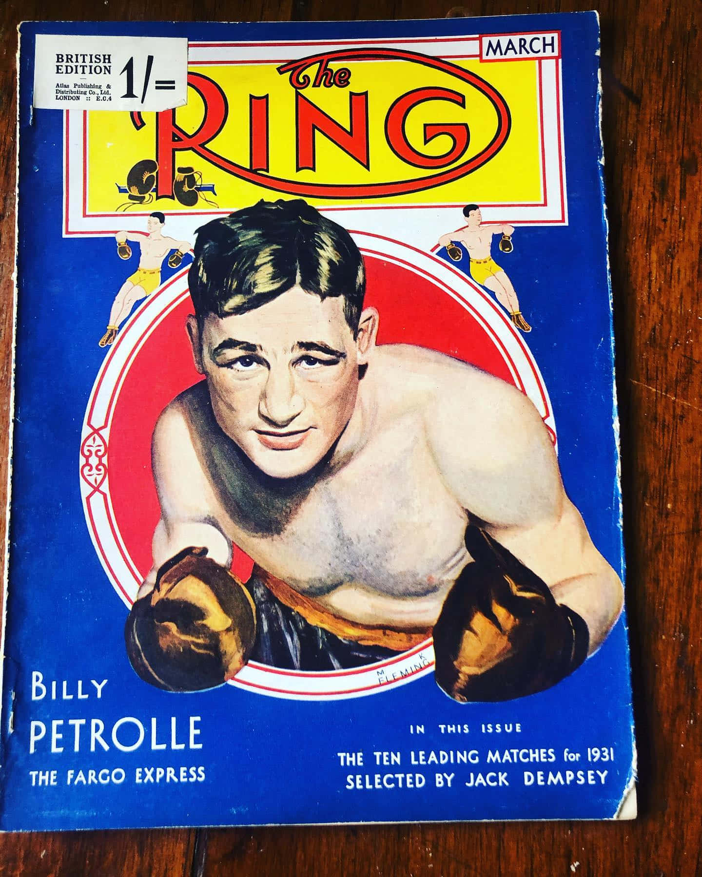 Magazine 桌布 壁紙 — 1931年復古拳擊雜誌封面，Billy Petrolle 以動態姿勢呈現，背景為大膽的藍色和紅色。