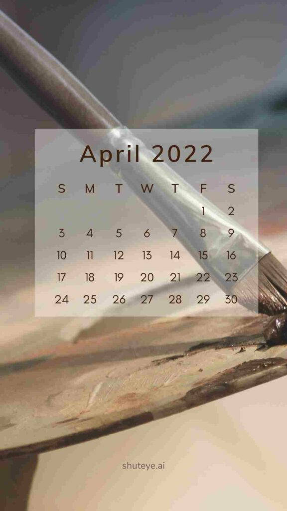 April 桌布 壁紙 — 2022年4月日曆疊加在一個特寫鏡頭上，顯示一支畫筆擱在帶有乾顏料的木製藝術家調色板上。
