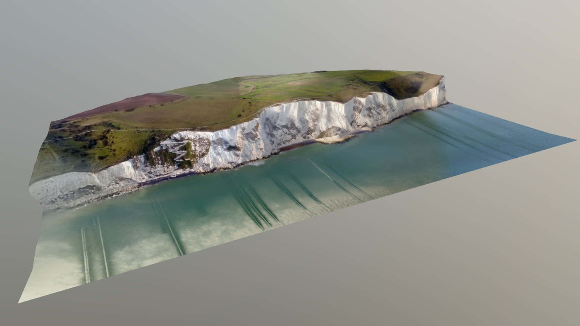 3D 桌布 壁紙 — 3D 渲染的海岸懸崖，白色白堊面，綠色草頂，下方是碧綠色的水。
