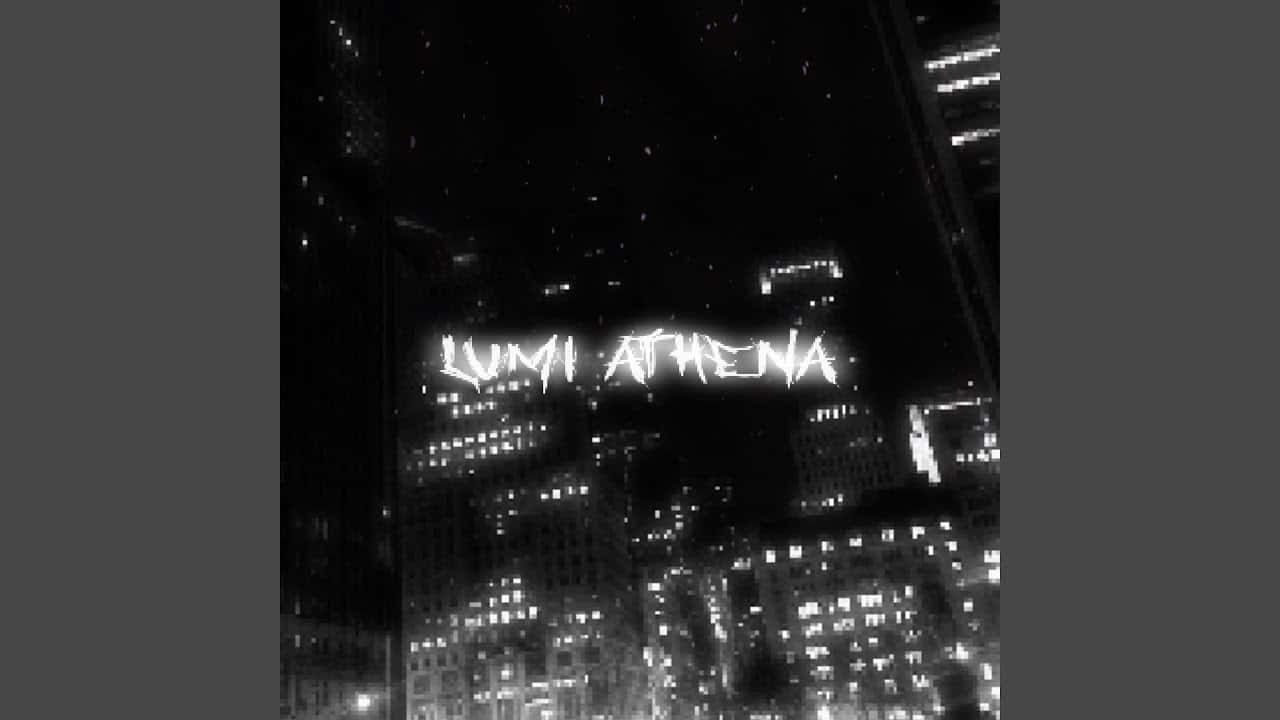  壁紙 — 黑白夜景城市景觀，帶有發光的窗戶和照亮摩天大樓的「LUMI ARENA」文字。