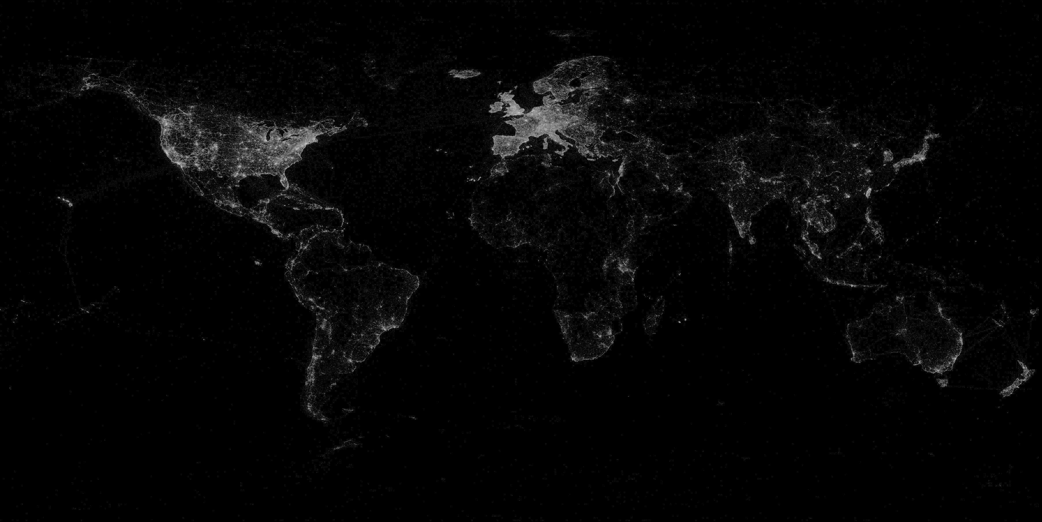 Global 桌布 壁紙 — 地球夜晚的黑白衛星圖像，顯示各大洲閃爍的城市燈光。