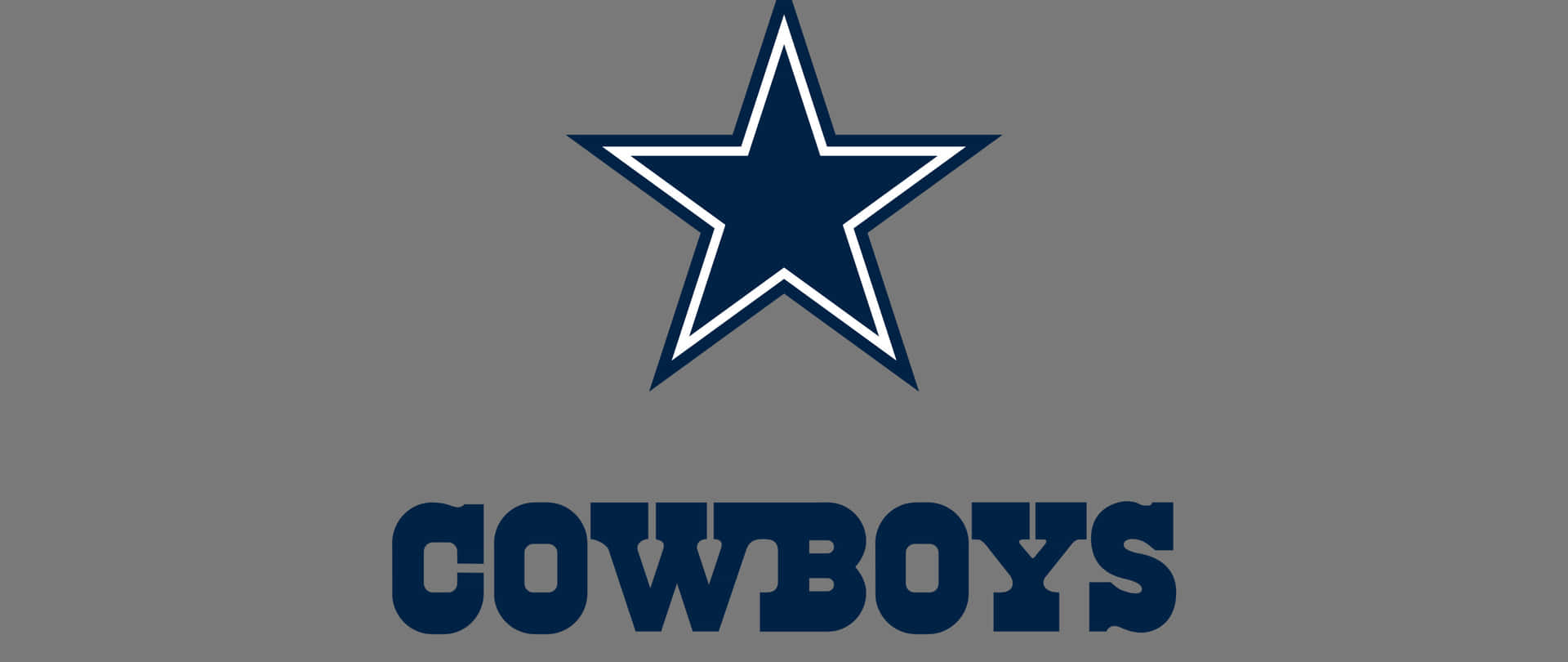  壁紙 — 一個大膽的藍色星星，帶有白色輪廓和 'COWBOYS' 文字，背景為純灰色。