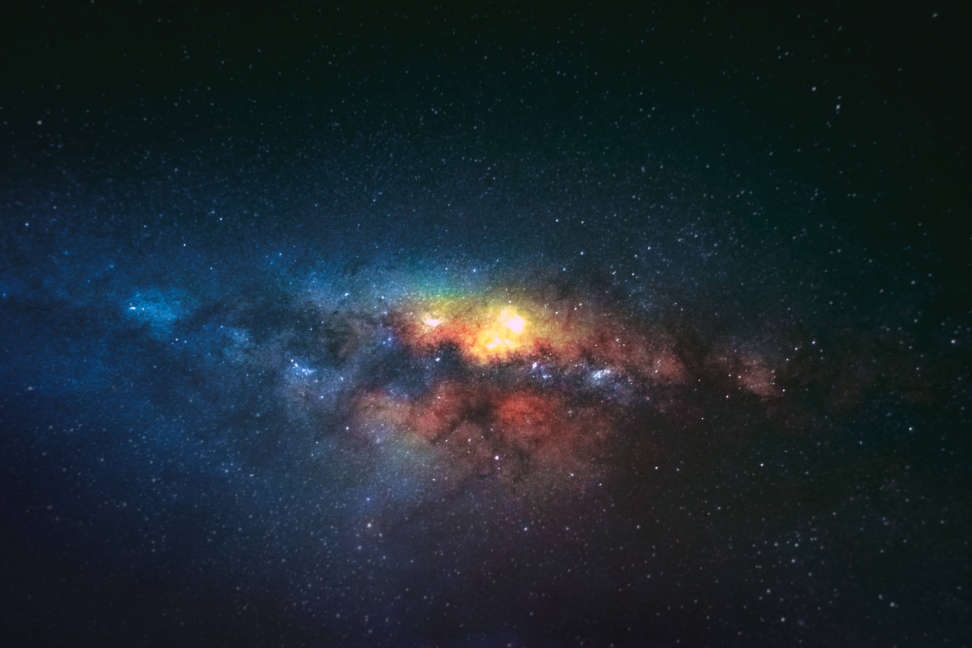 一個色彩繽紛的星系，在深空中擁有發光的星雲和無數的星星。 — Galaxy S10 壁紙