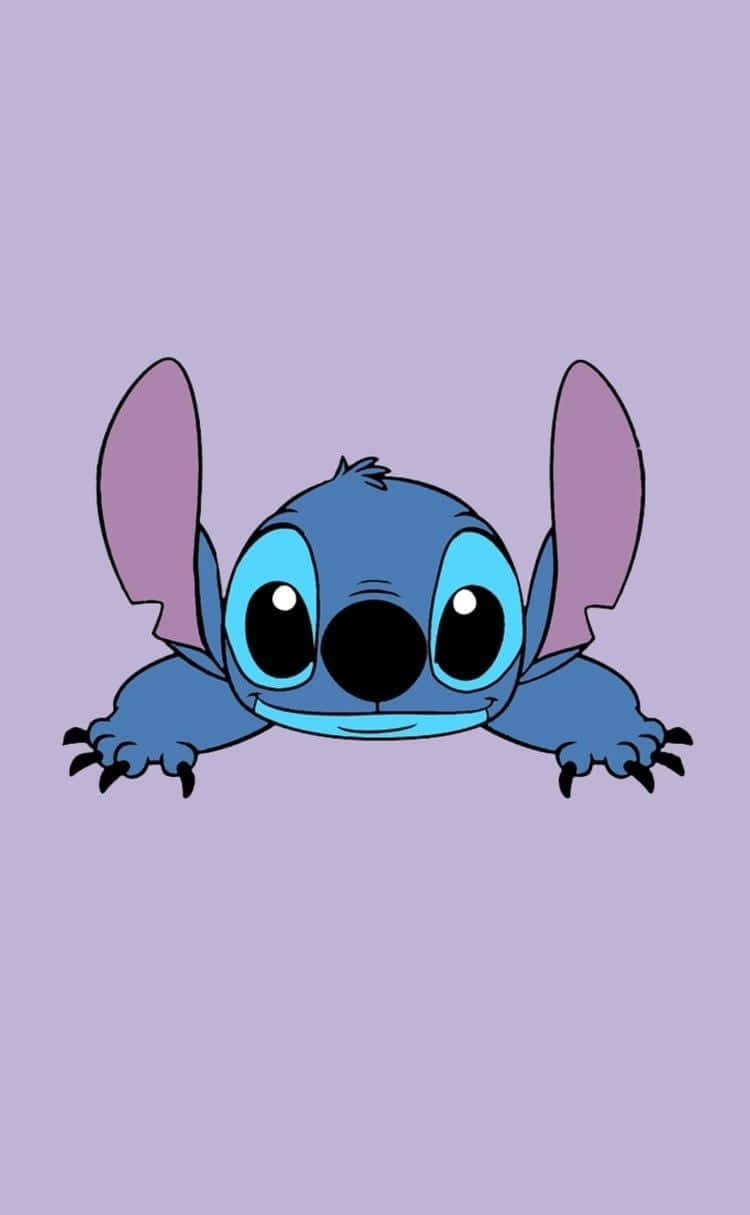 藍色外星人角色，有著大眼睛，從框架頂部窺視。 — Stitch 壁紙