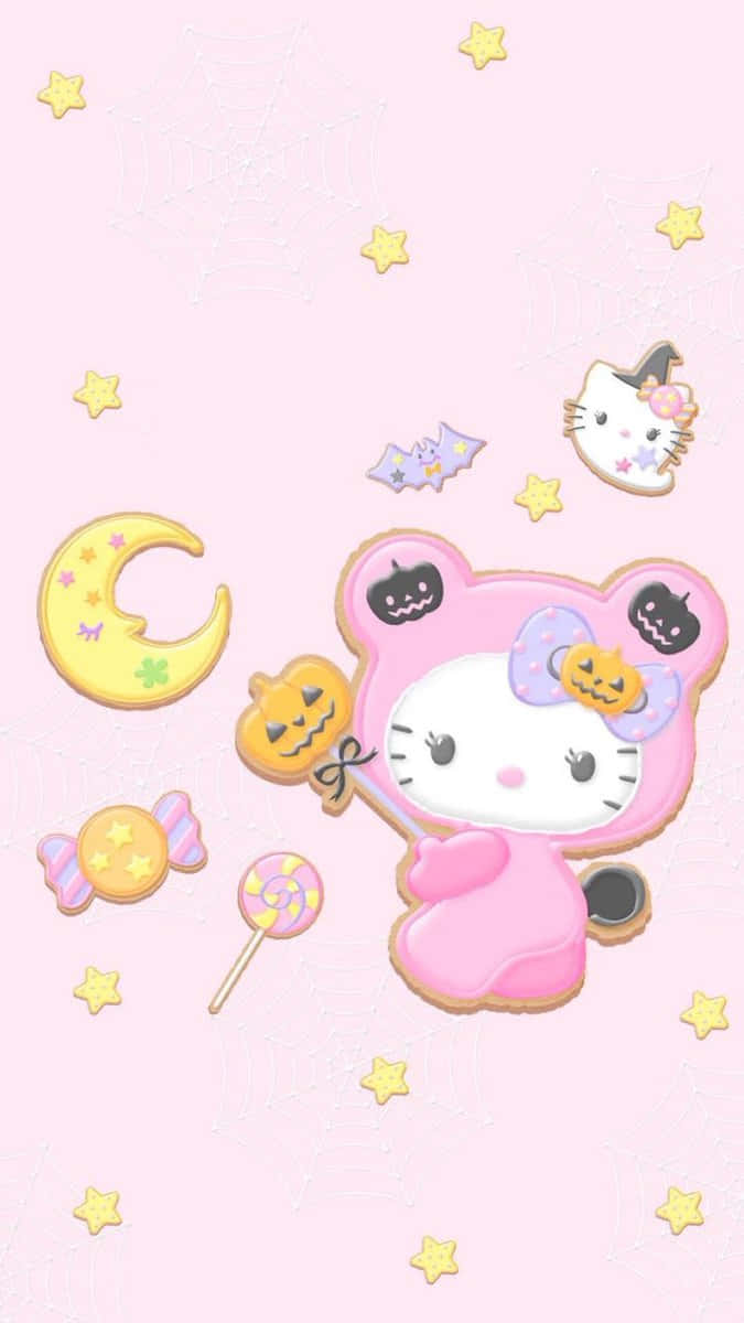  壁紙 — 一隻可愛的粉紅色Hello Kitty穿著萬聖節女巫服裝，手持南瓜魔杖，周圍有星星、蝙蝠和糖果，背景是柔和的粉紅色。