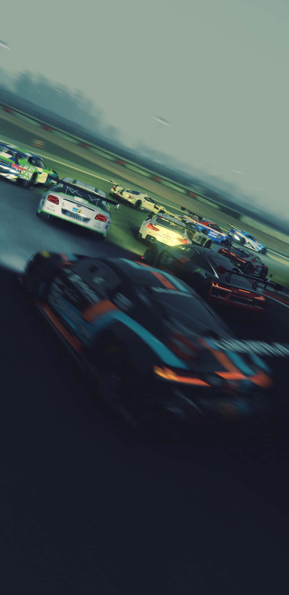 賽車在濕滑賽道上以動態模糊飛馳。 — Project Cars 2 壁紙