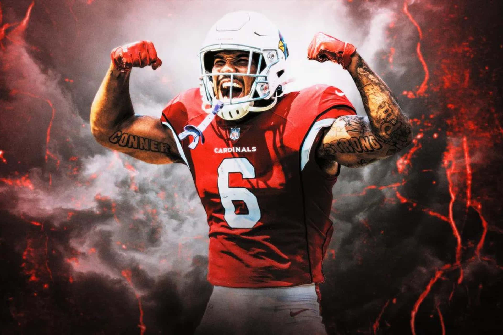  壁紙 — 一名身穿紅色 Cardinals 球衣的美式足球運動員在熾熱的火山背景下強力地展示肌肉。