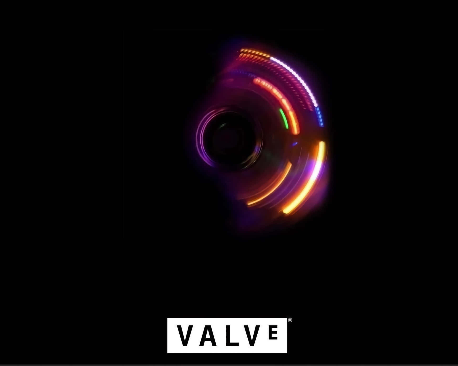  壁紙 — 一個發光多彩旋轉的指尖陀螺，黑色背景，底部有Valve標誌。