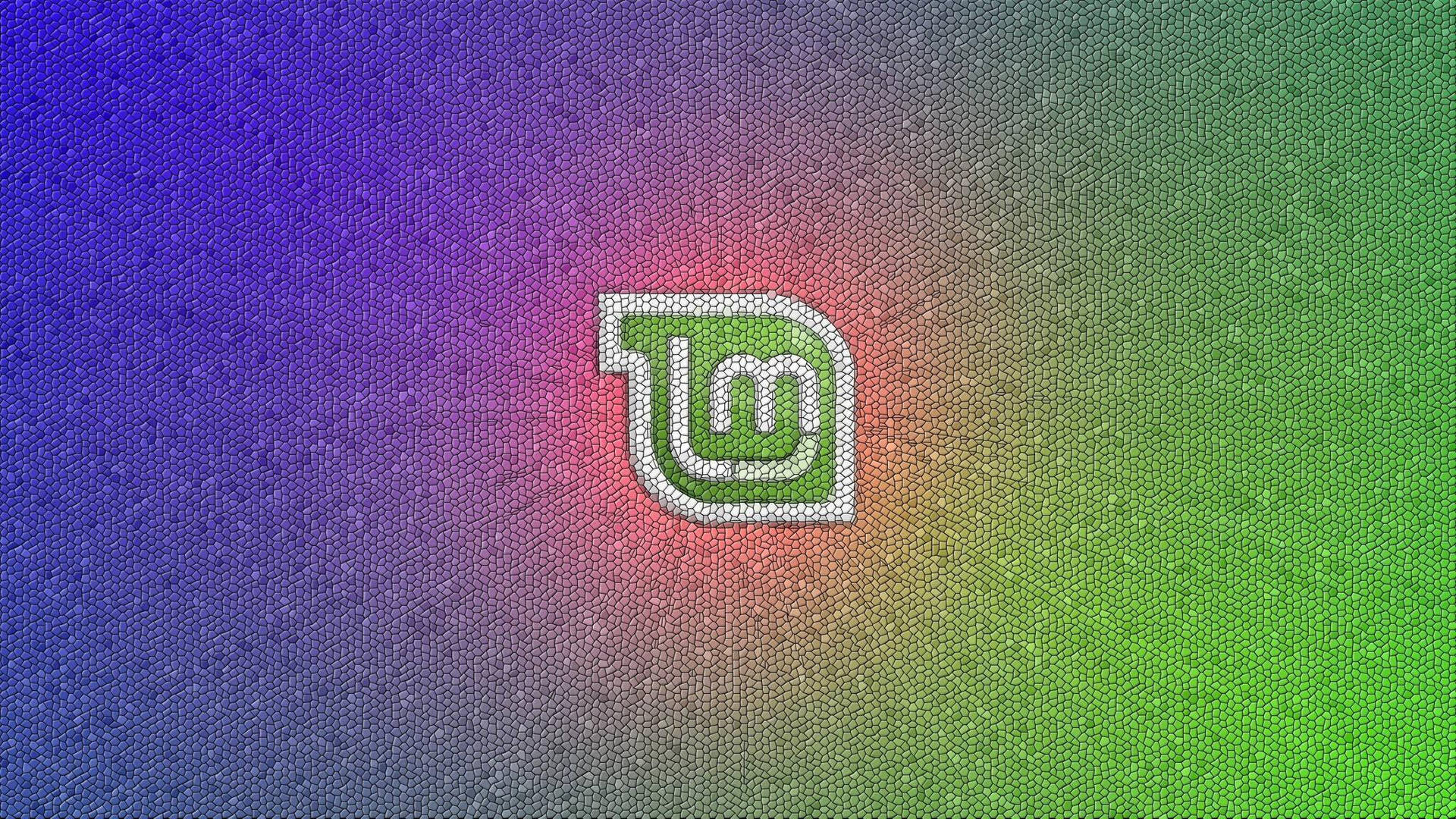 一個發光的綠色LM標誌，在彩色漸變六邊形背景上。 — Linux 壁紙