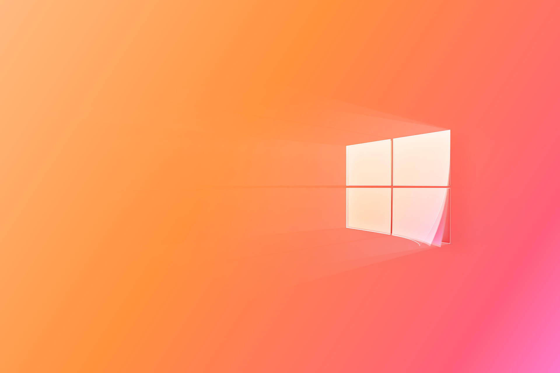 Windows標誌漂浮在橙色和粉色漸變背景上 — Windows 11 壁紙