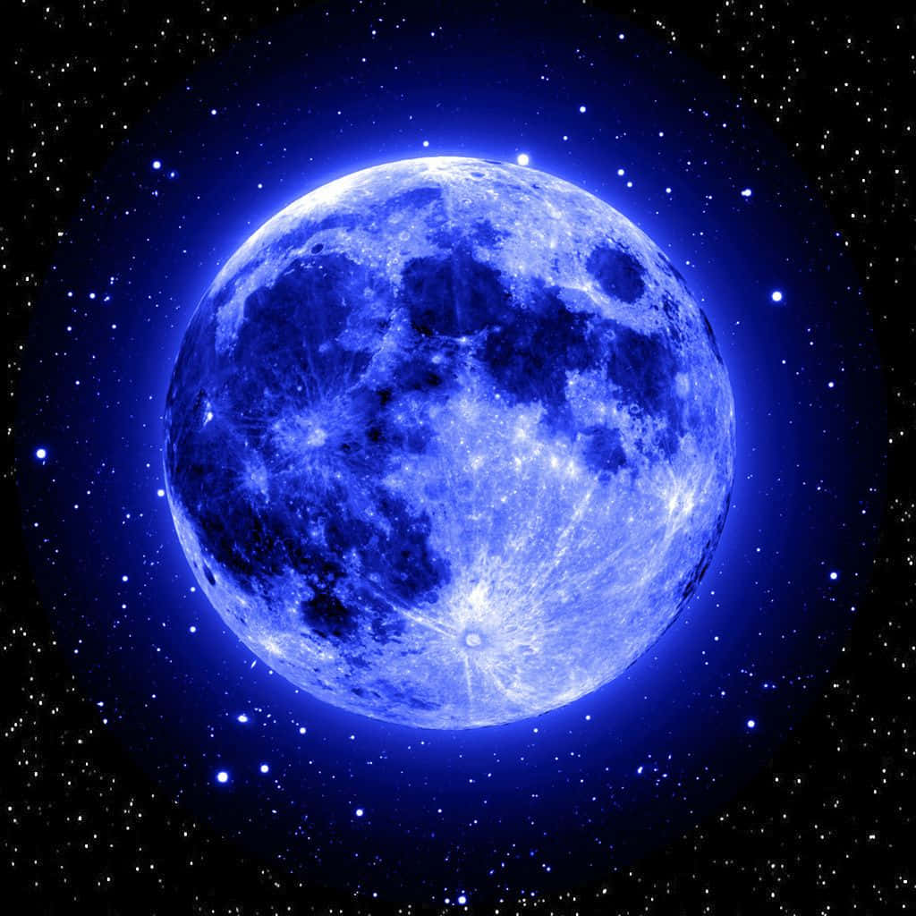  壁紙 — 一輪明亮的藍月在繁星點點的夜空中閃耀，散發出神聖的光芒。