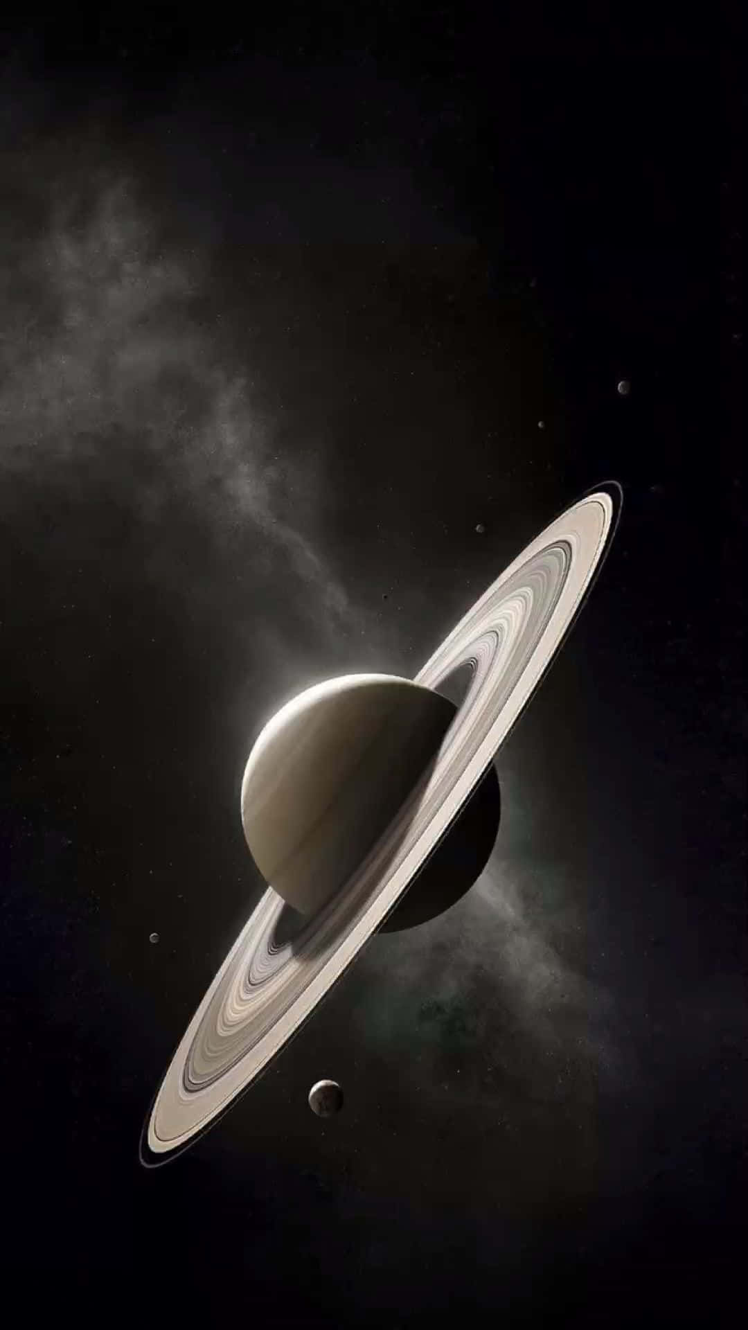  壁紙 — 宏偉的土星帶有複雜的環，在繁星點點的宇宙背景中，伴隨著飄移的星雲柔和地發光。