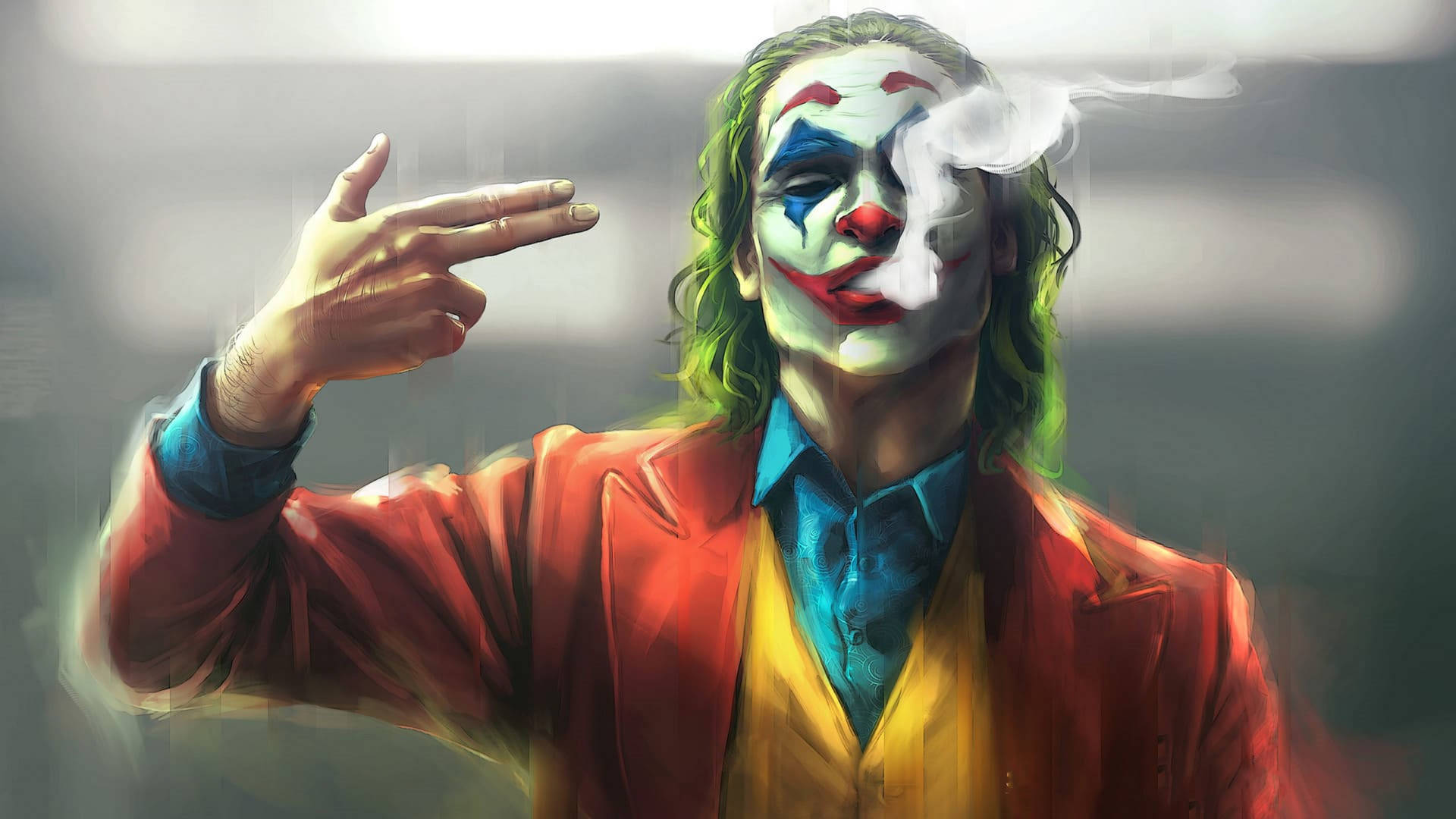 一個穿著紅色西裝的威脅性小丑在抽煙並指著觀眾。 — 小丑 壁紙
