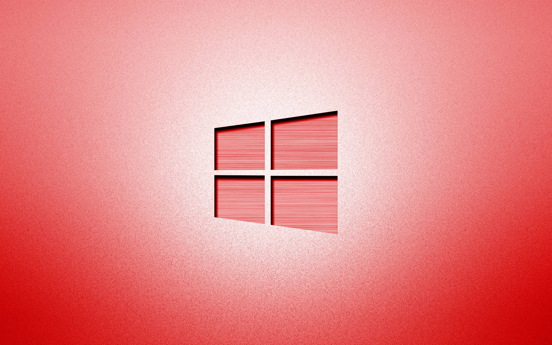 Windows標誌居中於紅色漸變背景上，帶有拉絲金屬紋理。 — Windows 11 壁紙