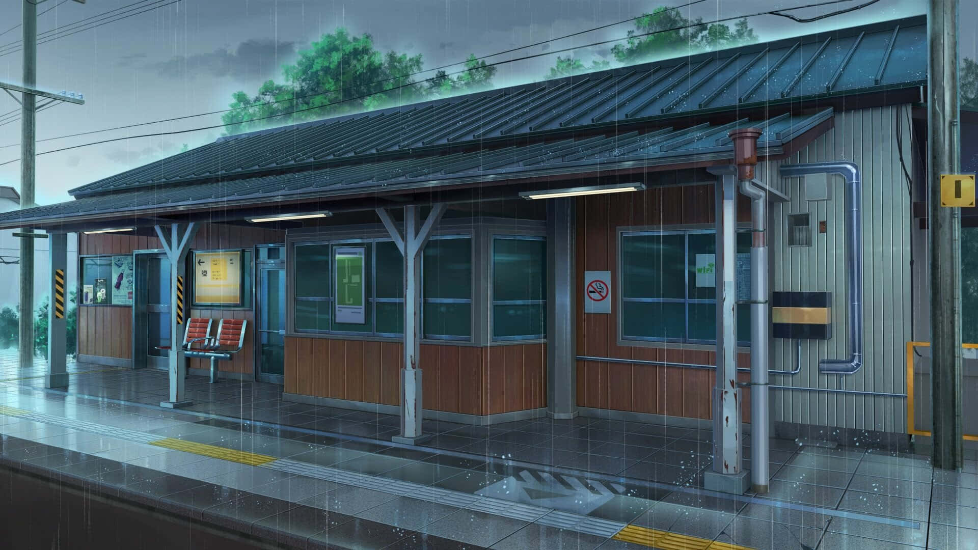  壁紙 — 黃昏時分，一個安靜的雨濕火車站月台，灰色天空下閃爍的燈光和濕漉漉的反光瓷磚。