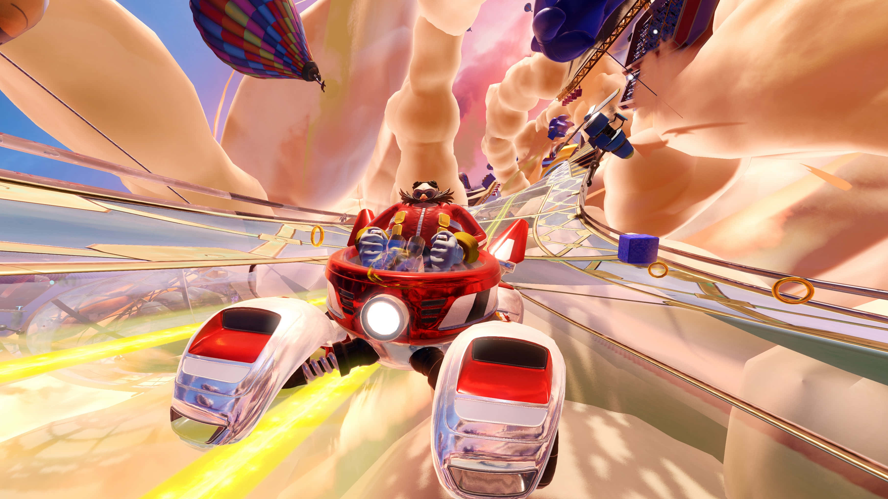 Sonic Battle Racers 桌布 壁紙 — 一輛紅色賽車在超現實的峽谷中疾馳，伴隨著熱氣球和發光環，呈現出充滿活力的數位賽車場景。