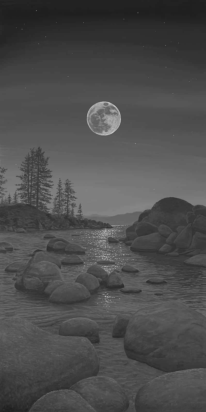  壁紙 — 一條寧靜的黑白河流在發光的滿月和繁星點點的夜空下流過巨石。