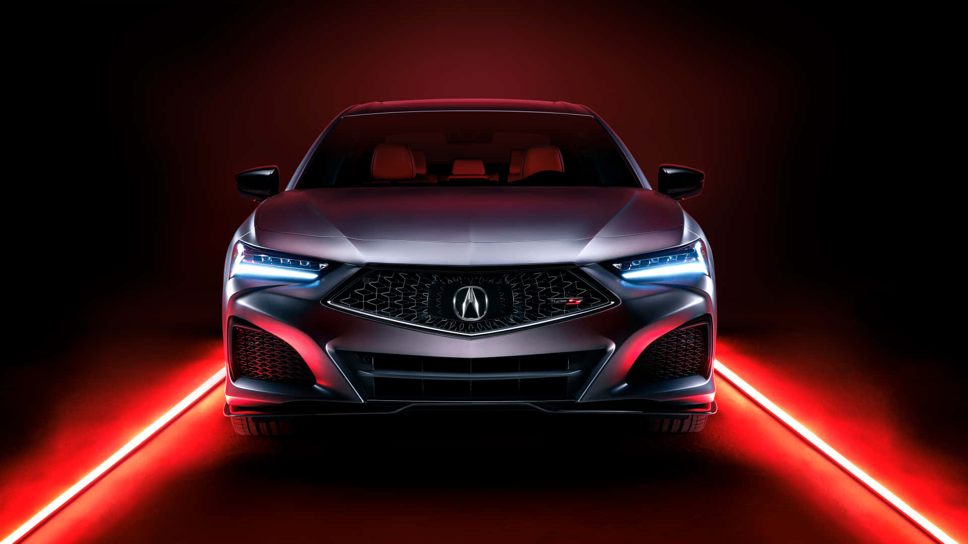 Acura Tlx 桌布 壁紙 — 一輛時尚的銀色Acura跑車在戲劇性的紅色燈光下向前，帶有發光的藍色車頭燈。