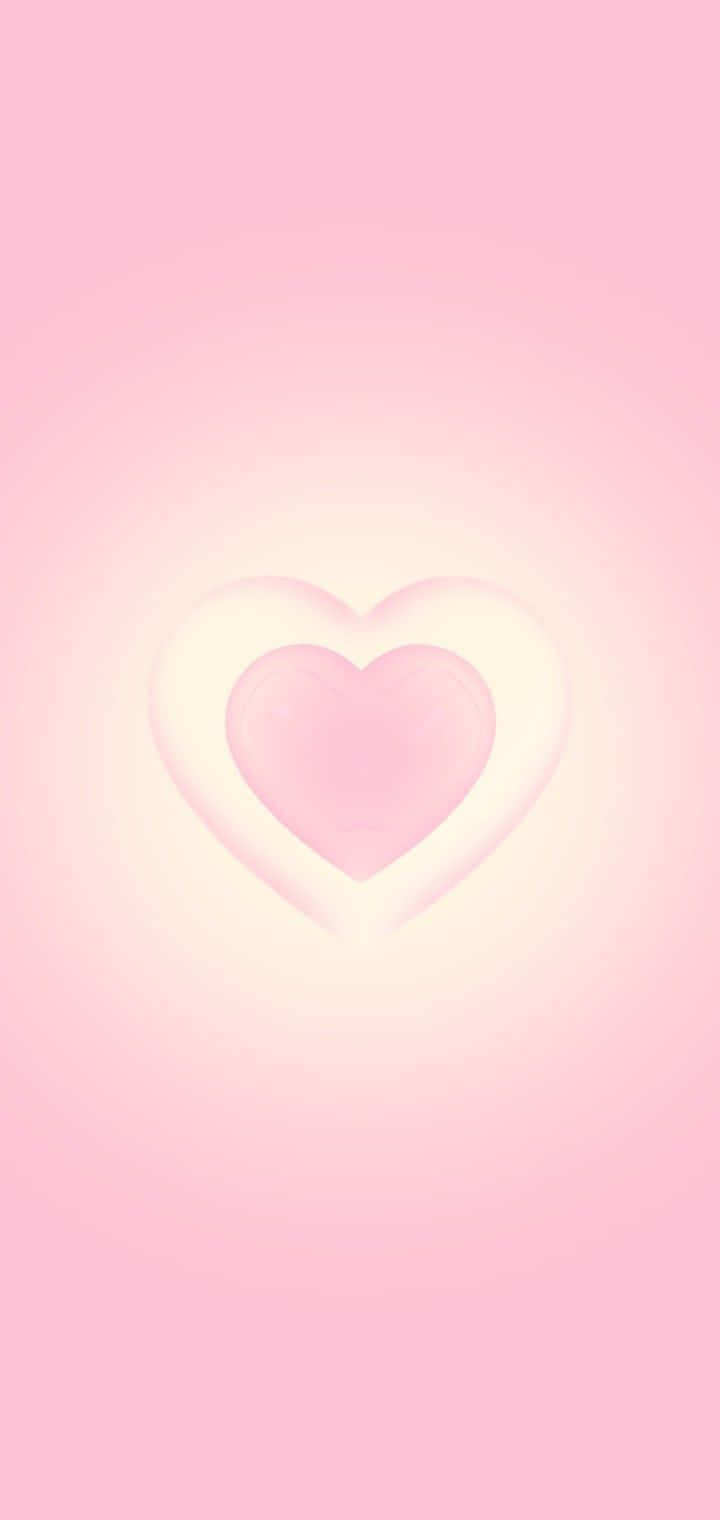 Pink Heart Aura 桌布 壁紙 — 一顆柔和發光的心臟在粉彩色漸變背景上散發出溫柔的光芒。