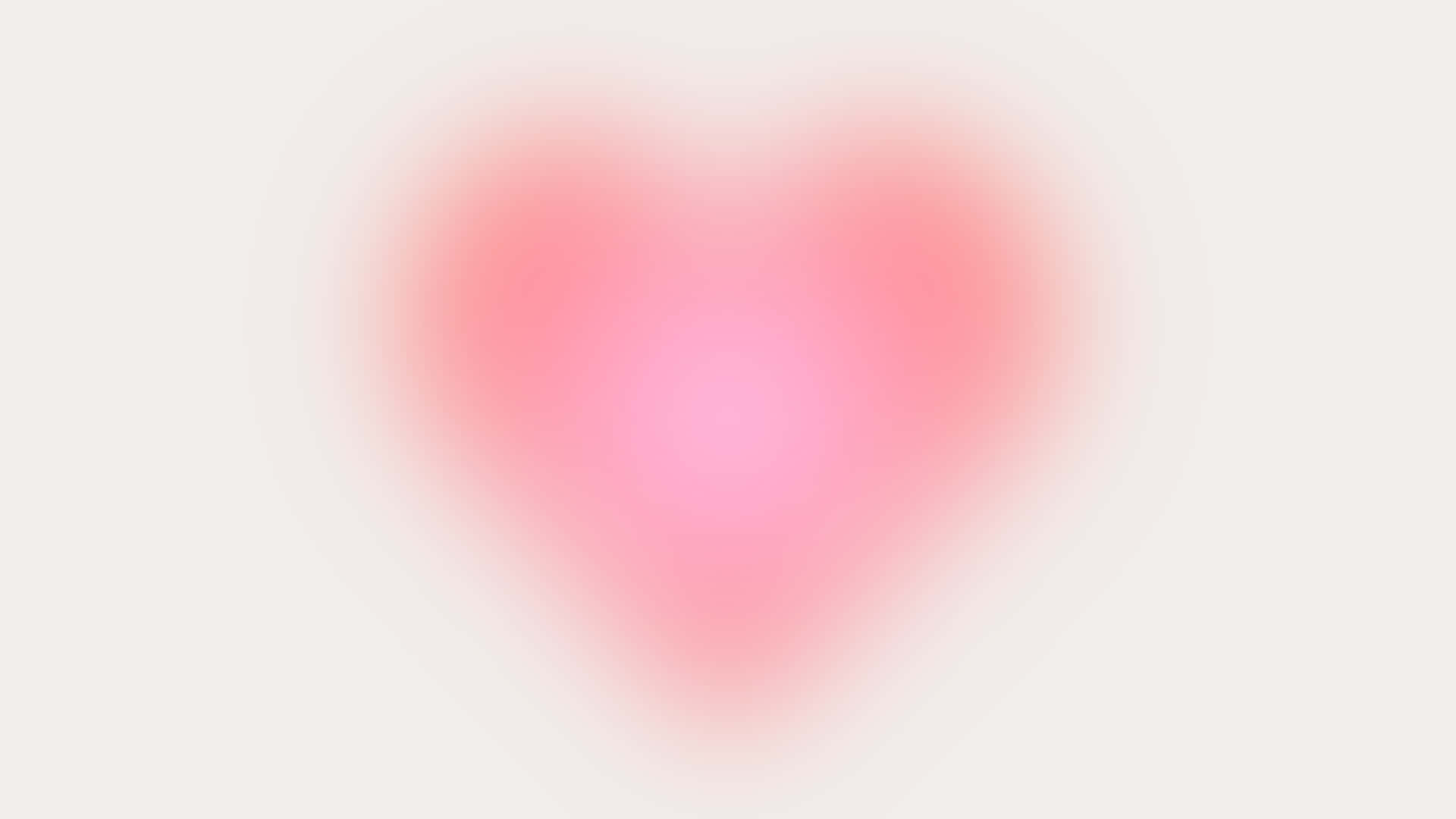  壁紙 — 一個柔和發光的心形在淡色背景上散發出溫柔的粉紅色調。