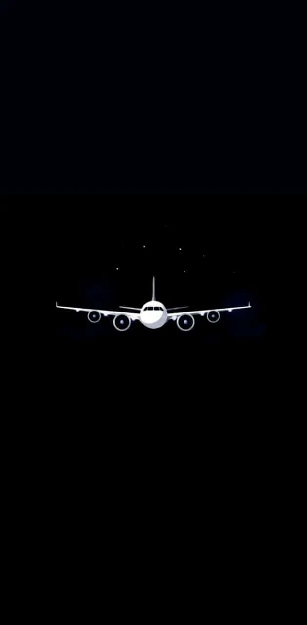  壁紙 — 一架清晰的白色飛機剪影在點綴著微弱星星的深黑色夜空飛行。