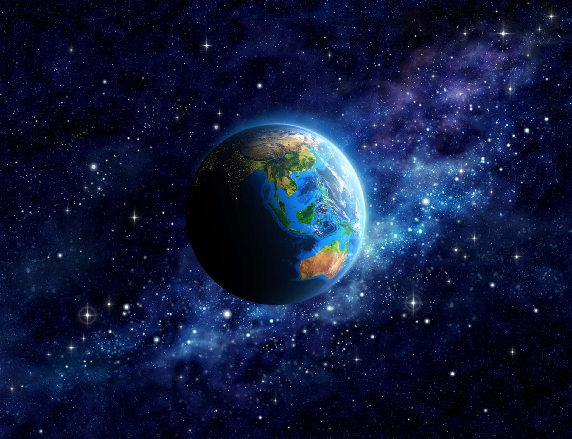  壁紙 — 從太空看到地球的壯麗景色，城市燈光在繁星宇宙背景下閃耀。