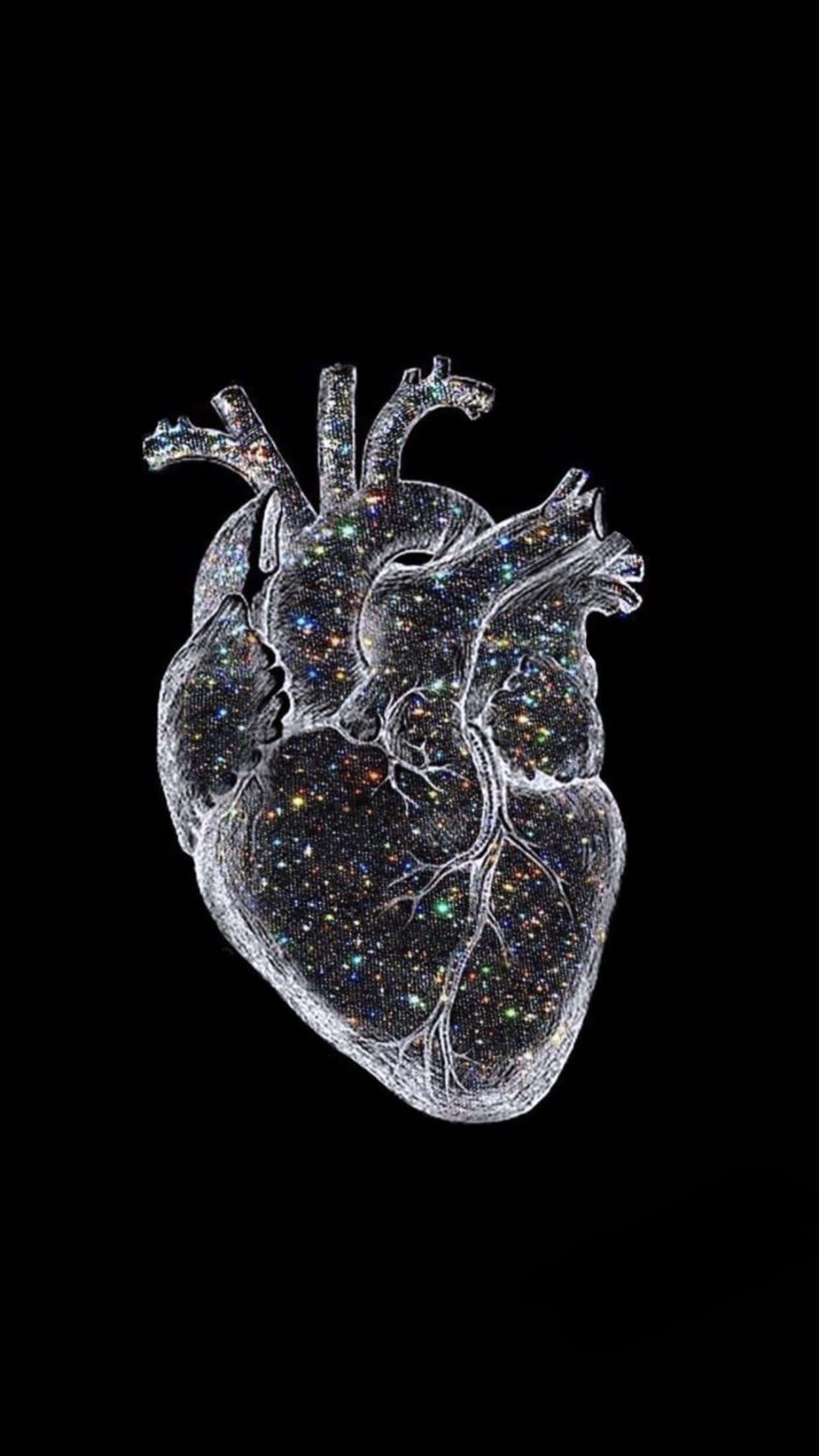 Medicina 桌布 壁紙 — 一個半透明的解剖學心臟，充滿閃爍星星，襯托黑色虛空。