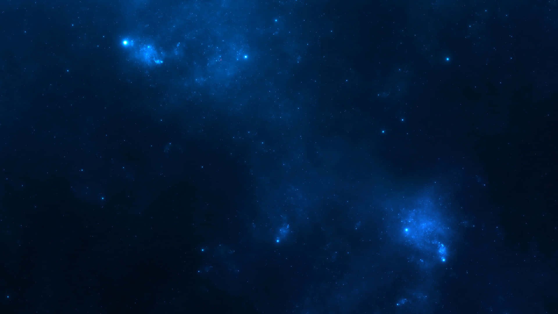  壁紙 — 廣闊的宇宙空間，充滿了發光的藍色星雲和散落的星星，背景是深靛藍色的虛空。