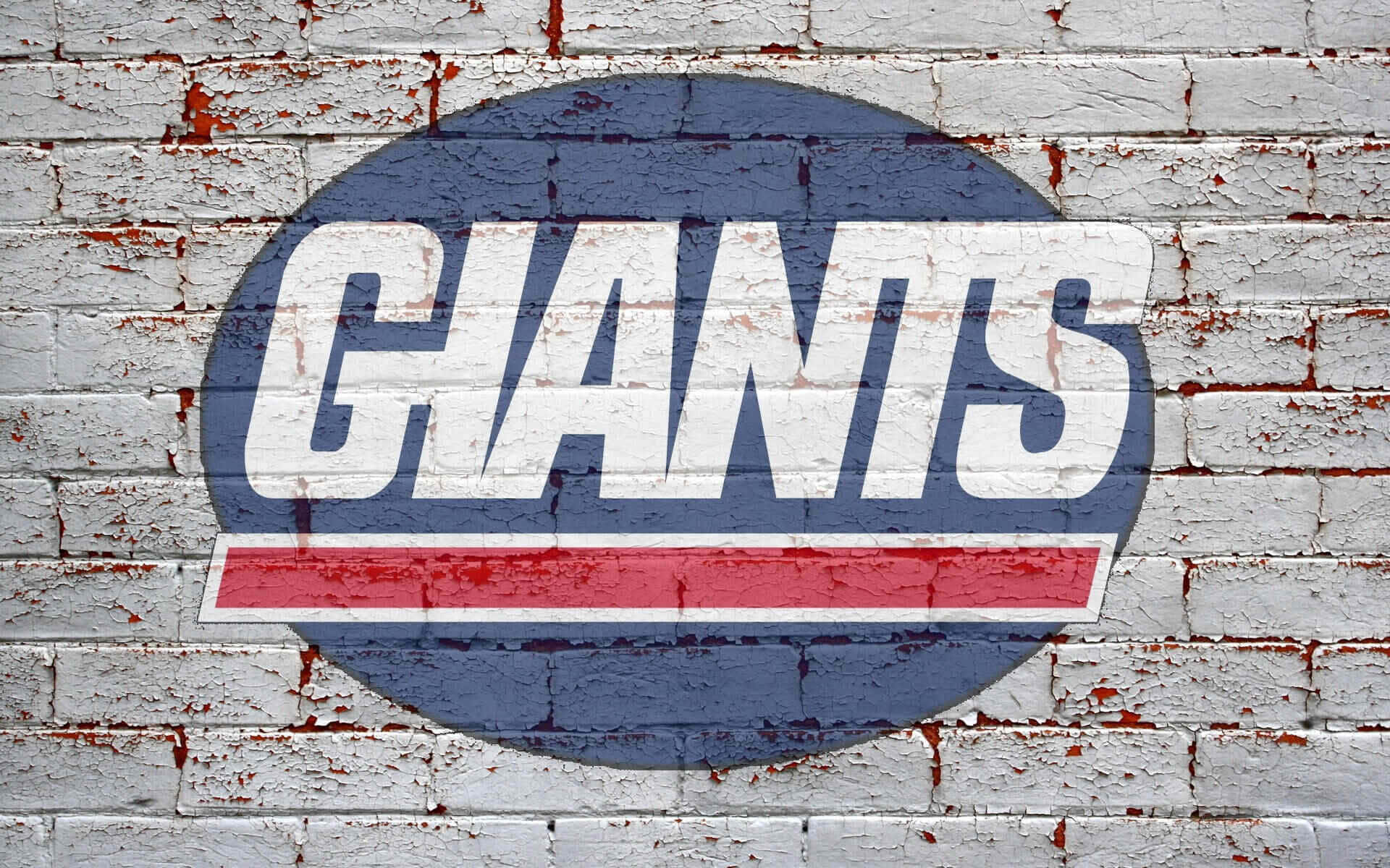  壁紙 — 一個風化的 'GIANTS' 標誌，以粗體白色和紅色繪製在裂開的白色磚牆上，油漆剝落。