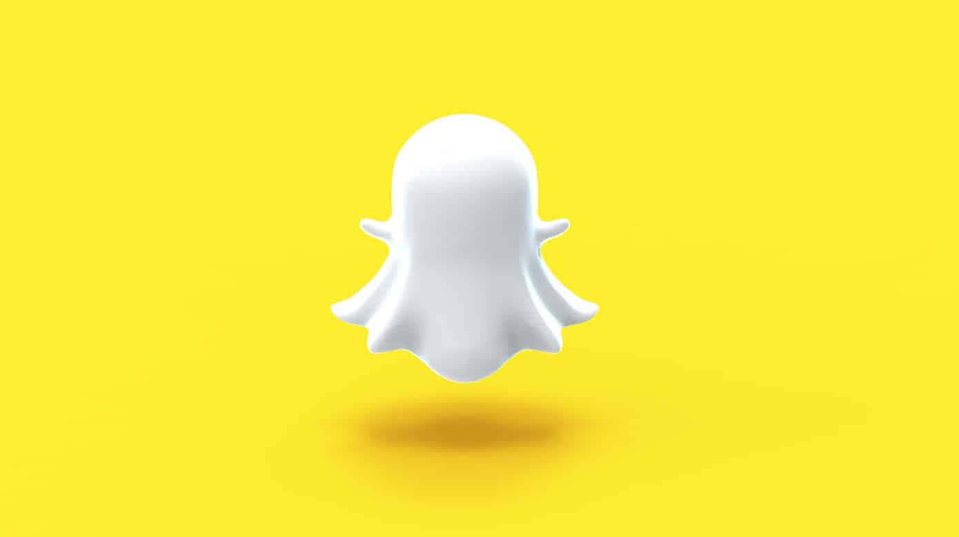  壁紙 — 一個白色鬼魂標誌漂浮在充滿活力的黃色背景上，投下柔和的陰影。