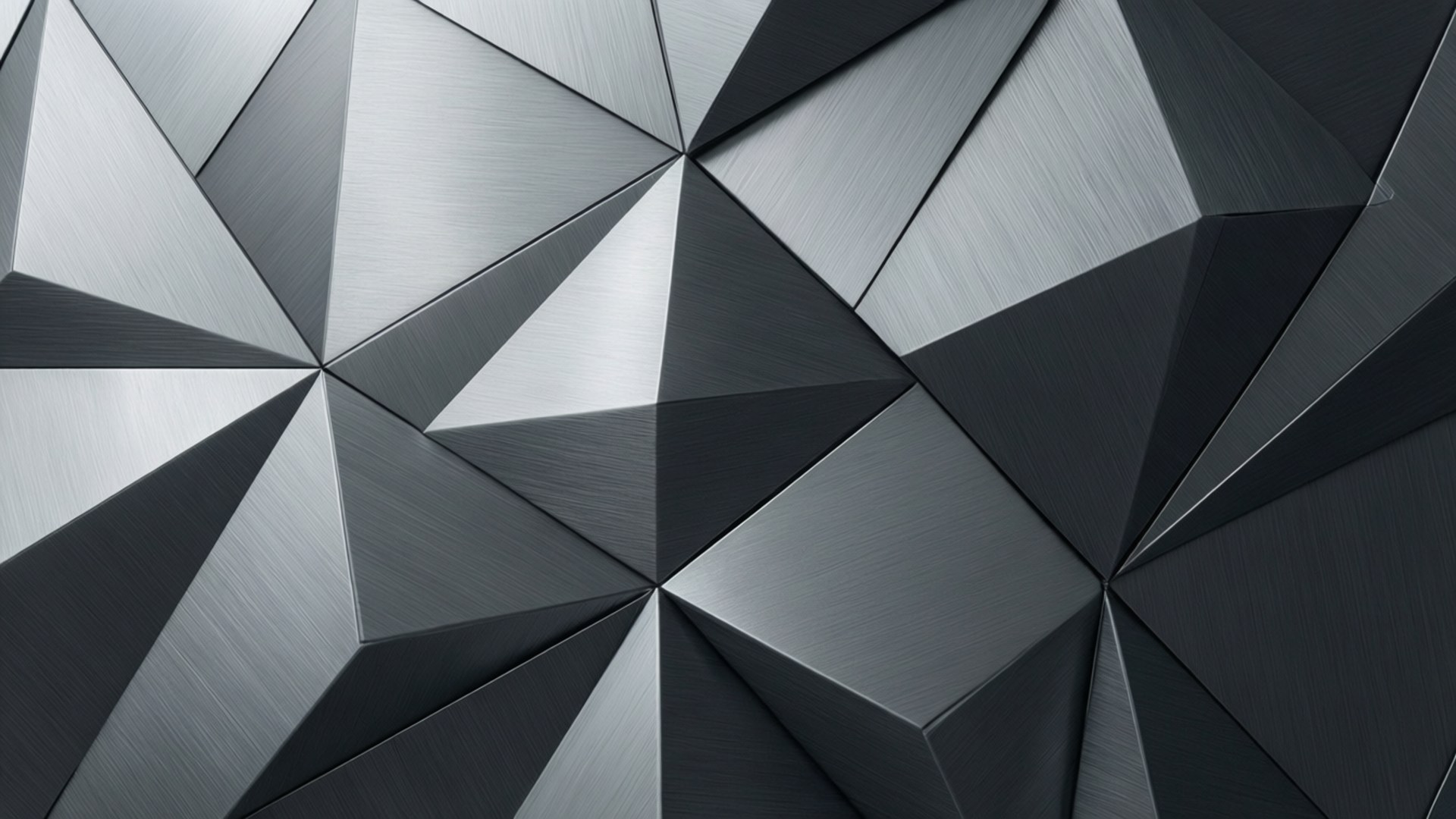Grey Geometric Abstraction 壁紙 — 抽象幾何圖案，由拉絲金屬三角形組成，呈現不同深淺的銀色和炭灰色。