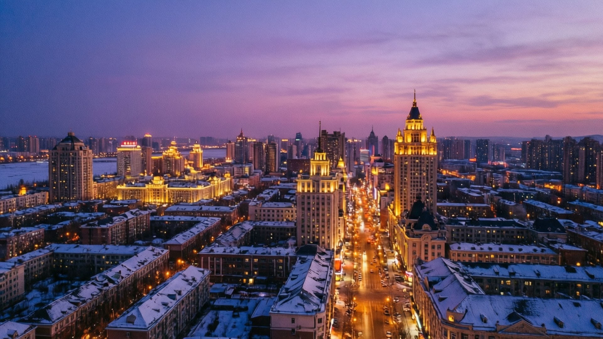 Harbin Dusk Skyline 壁紙 — 黃昏時分雪景城市景觀的鳥瞰圖，金色建築和紫色天空。