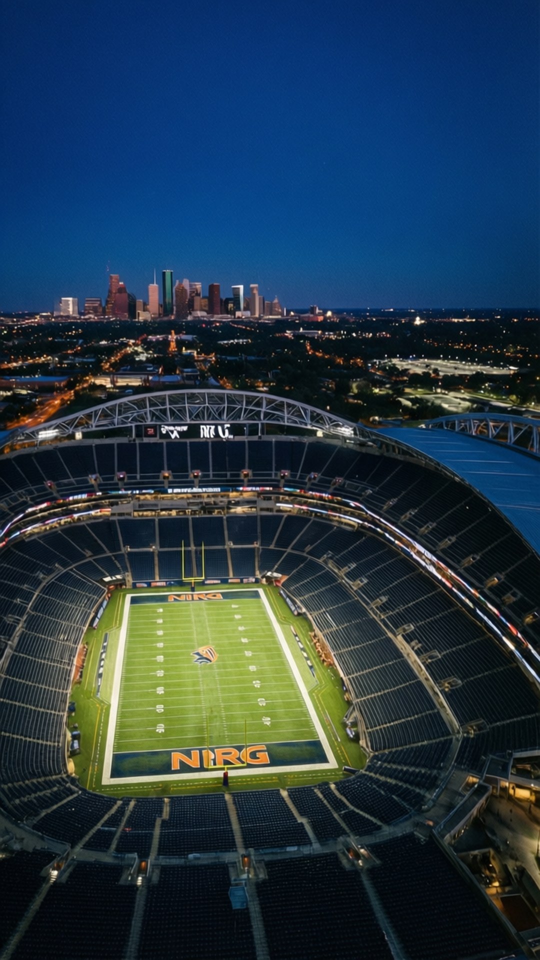 NRG Night Lights 壁紙 — 黃昏時分空無一人的NFL體育場鳥瞰圖，背景中城市天際線閃耀。