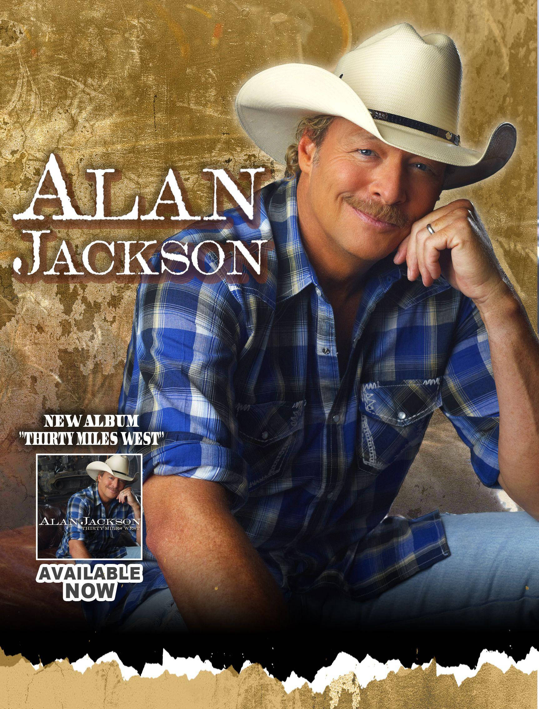 Alan Jackson 桌布 壁紙 — Alan Jackson 戴著牛仔帽和藍色格紋襯衫，在帶有紋理的金色背景前溫暖地微笑，宣傳他的新專輯。