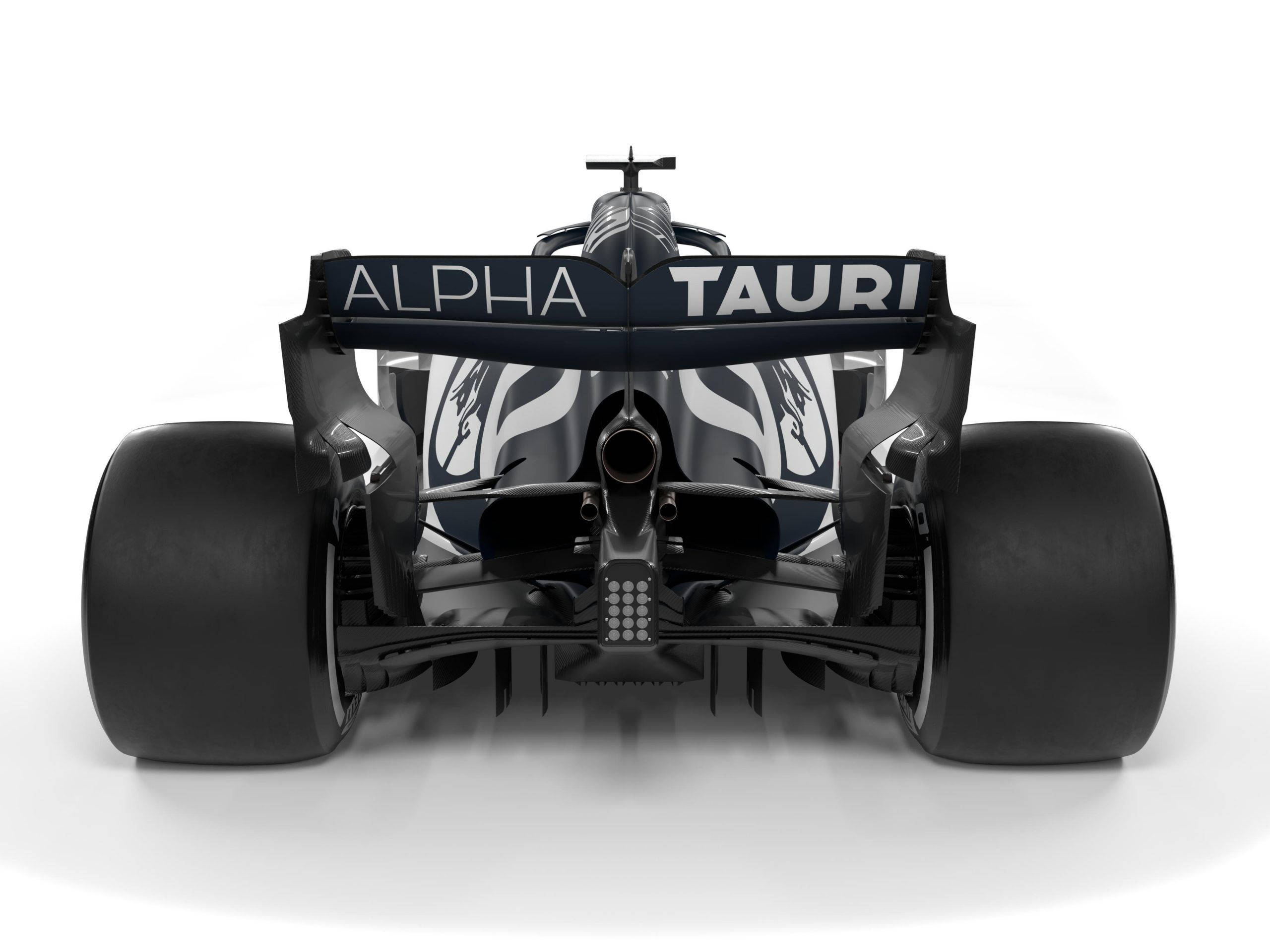 黑白 桌布 壁紙 — Alpha Tauri 一級方程式賽車的後視圖，在純白背景上展示其空氣動力學設計和大膽的黑白塗裝。
