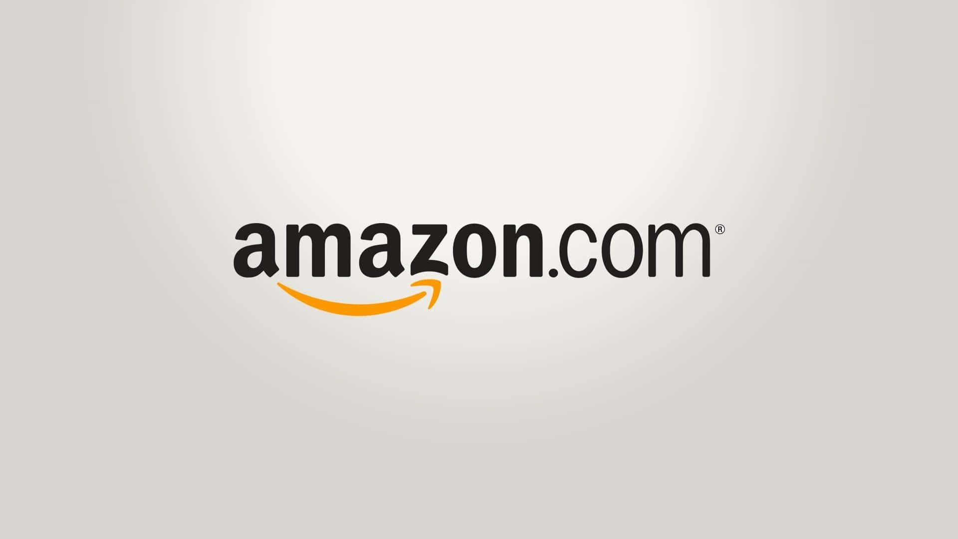 亞馬遜 桌布 壁紙 — Amazon.com 標誌，帶有橙色箭頭，淺灰色漸變背景。