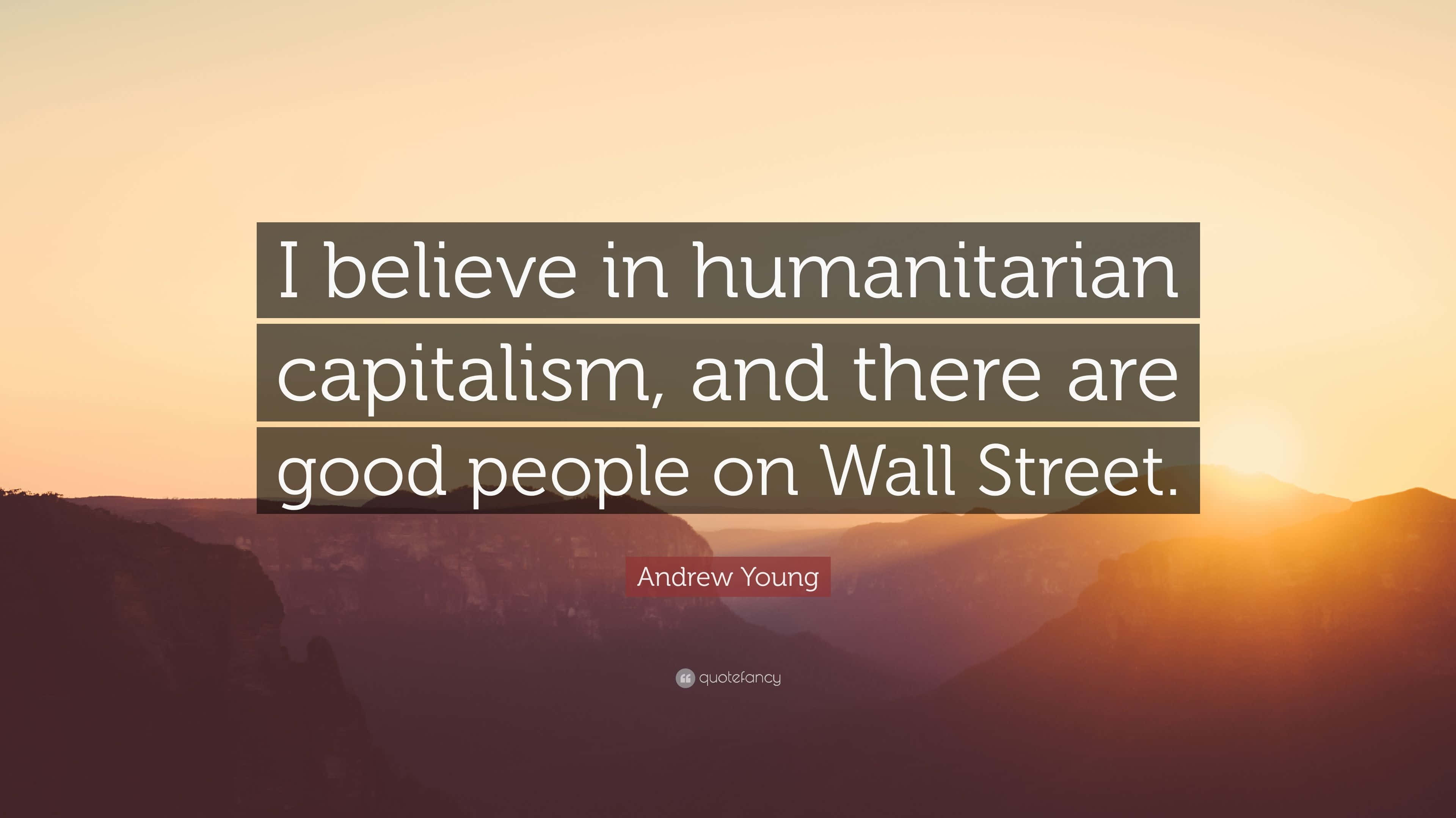 Humanitarian 桌布 壁紙 — Andrew Young 的一句勵志名言覆蓋在寧靜的山景日落上，帶有溫暖的金色和橙色色調。