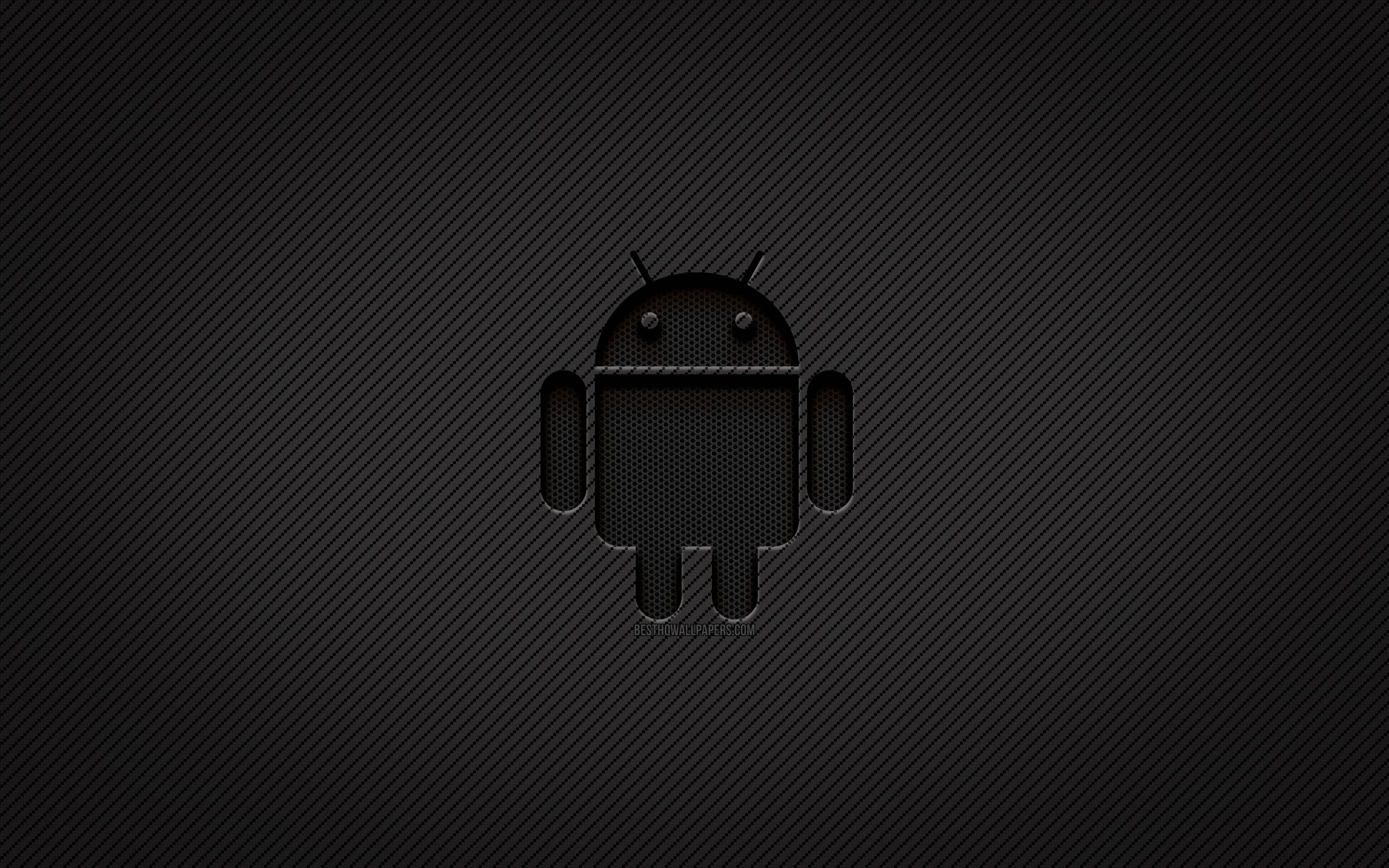 Android Desktop 桌布 壁紙 — Android 機器人標誌居中於深色碳纖維紋理背景上，帶有微妙的對角線。