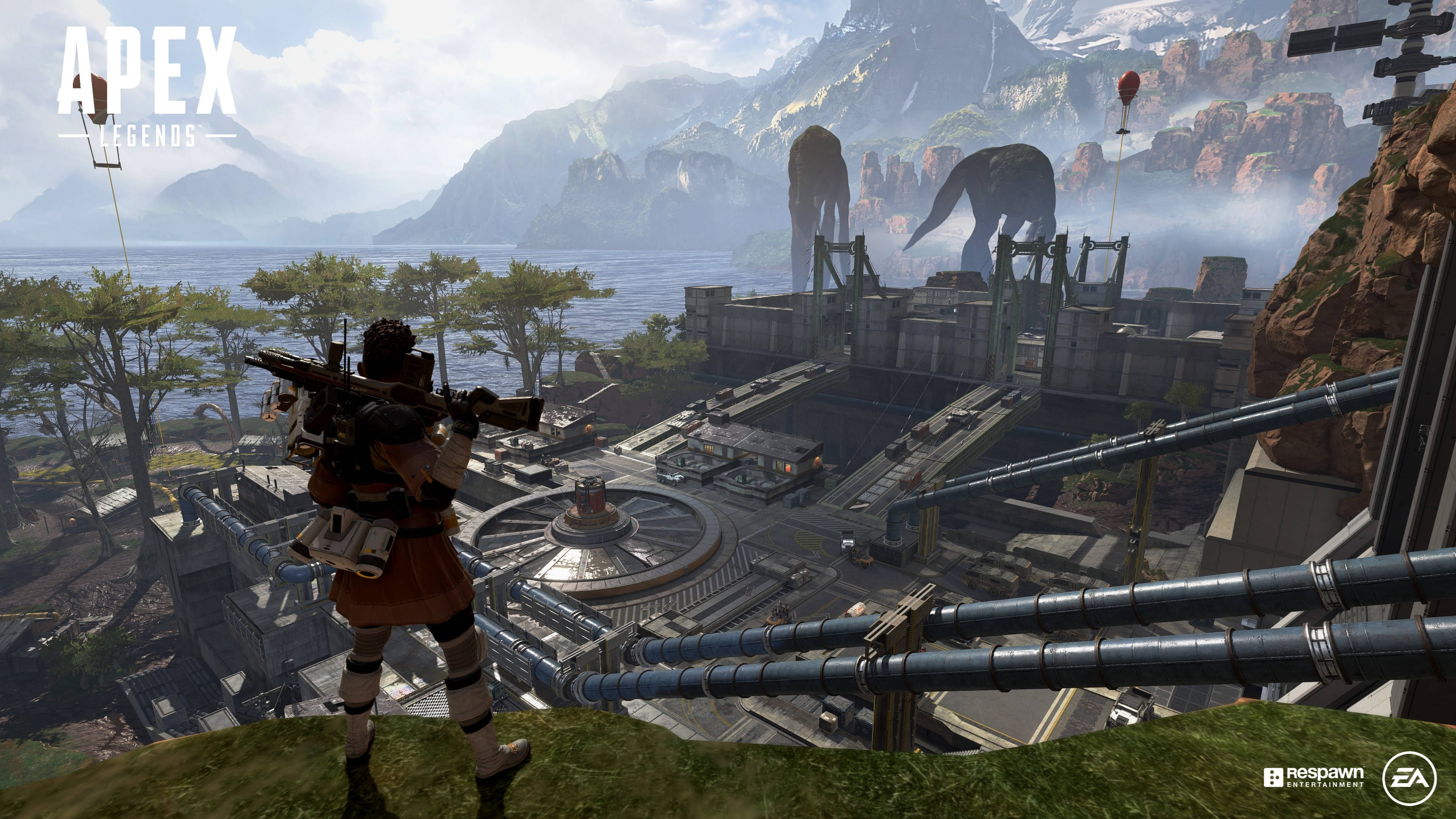 Legends 桌布 壁紙 — Apex Legends 中的玩家俯瞰著一個坐落於山脈與海洋之間的廣闊工業綜合體，遠處有巨大的機械野獸。