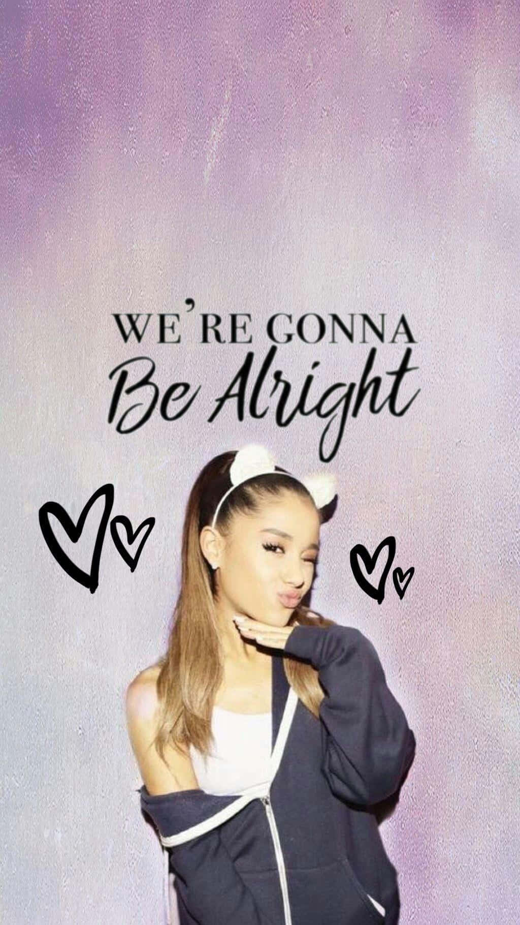 Aesthetic Ariana Grande 桌布 壁紙 — Ariana Grande 在柔和的紫色漸變背景前擺出俏皮的姿勢，帶有「We're Gonna Be Alright」字句和心形塗鴉。