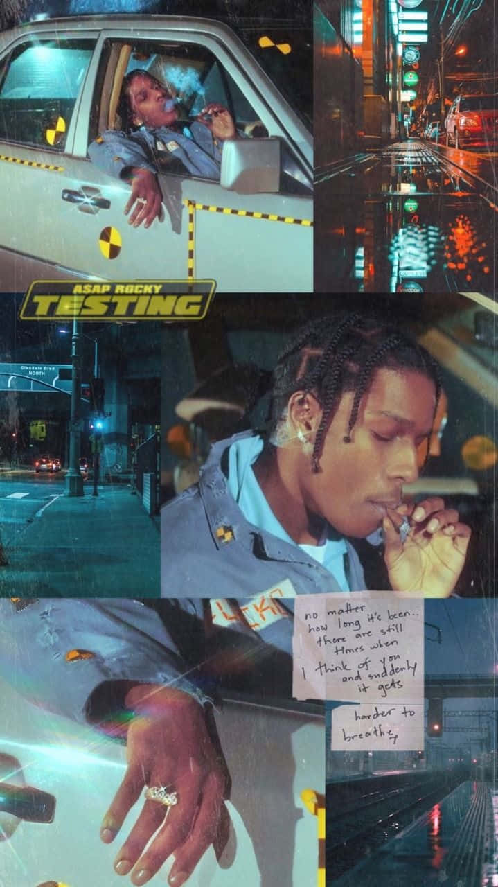 album 桌布 壁紙 — ASAP Rocky 在夜晚的車內吸煙，周圍是霓虹燈照亮的城市街道和反光的濕漉漉路面。