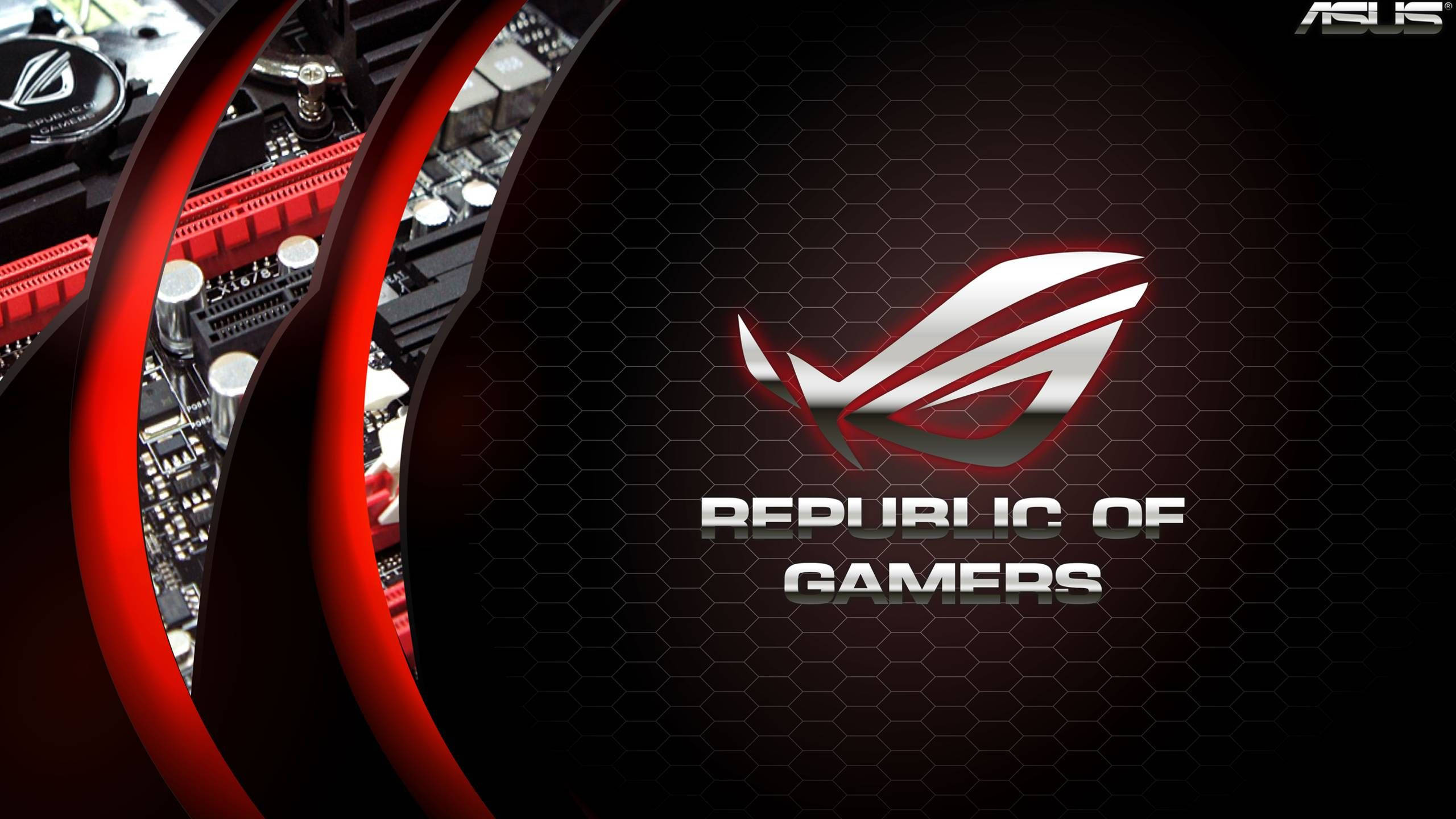 ASUS 桌布 壁紙 — ASUS ROG 主機板特寫，帶有發光的紅色點綴和 Republic of Gamers 標誌，背景為六邊形黑色。