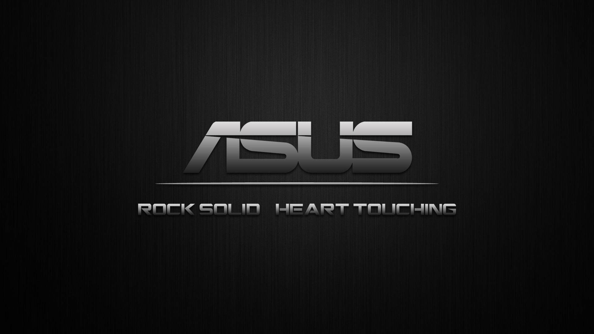 ASUS 桌布 壁紙 — ASUS 標誌以金屬銀色呈現，背景為紋理黑色，附有標語 rock solid heart touching。