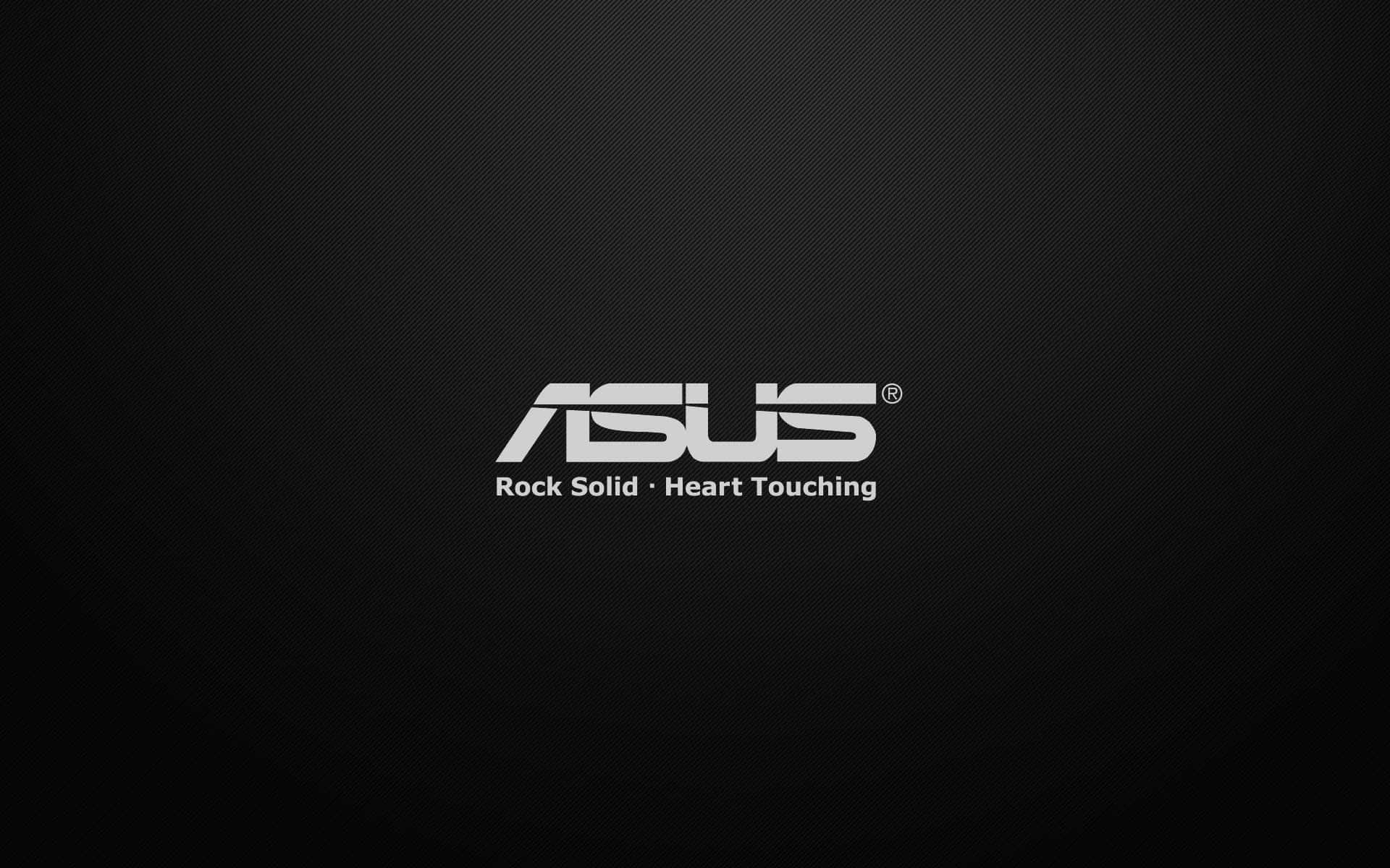 ASUS 桌布 壁紙 — ASUS 標誌以銀色文字顯示在深色紋理黑色背景上，附有標語 Rock Solid Heart Touching。