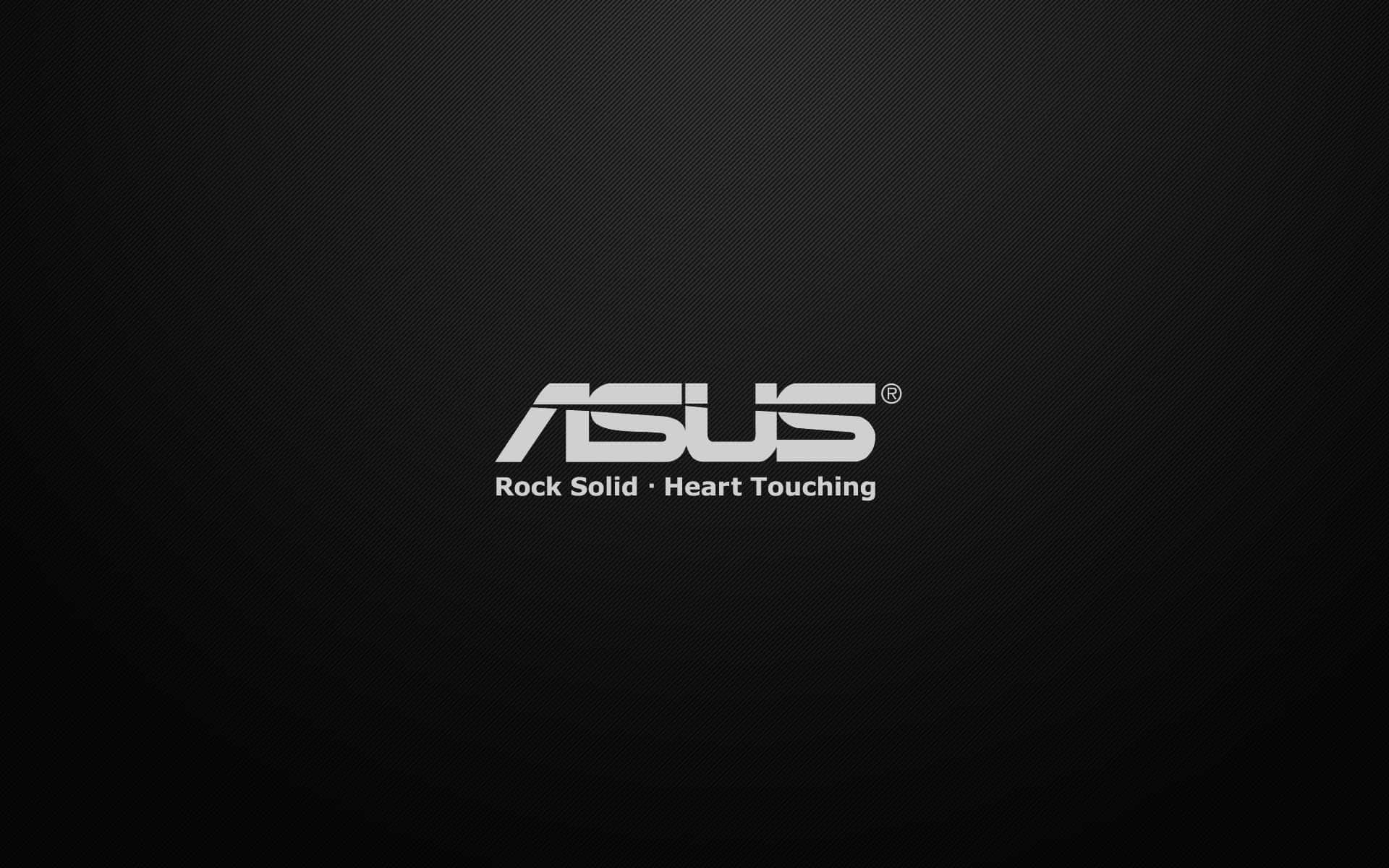 ASUS 桌布 壁紙 — ASUS 標誌以銀色文字顯示在深色紋理黑色背景上，附有標語 Rock Solid Heart Touching。