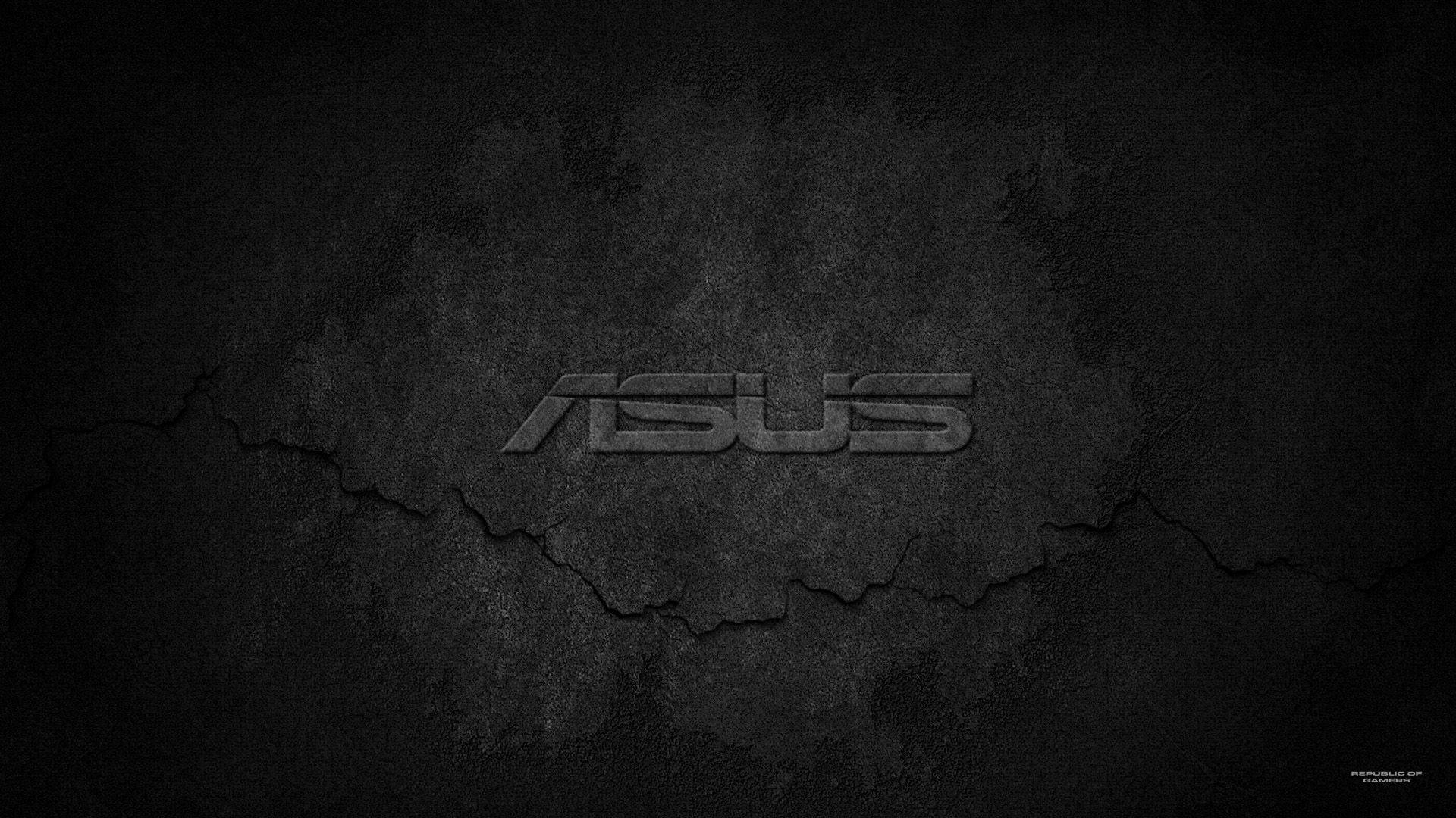 ASUS 桌布 壁紙 — ASUS 標誌蝕刻在裂開的深色混凝土上，帶有粗糙紋理和微妙照明。
