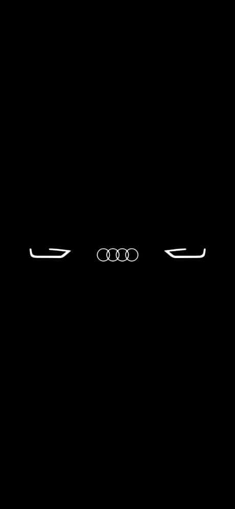 奧迪 桌布 壁紙 — Audi 標誌和頭燈在純黑色背景上發出白色光芒，呈現極簡汽車設計風格。