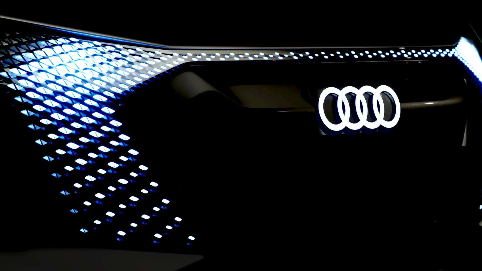 高清 桌布 壁紙 — Audi 汽車前格柵在黑暗背景下以藍色 LED 燈照亮。