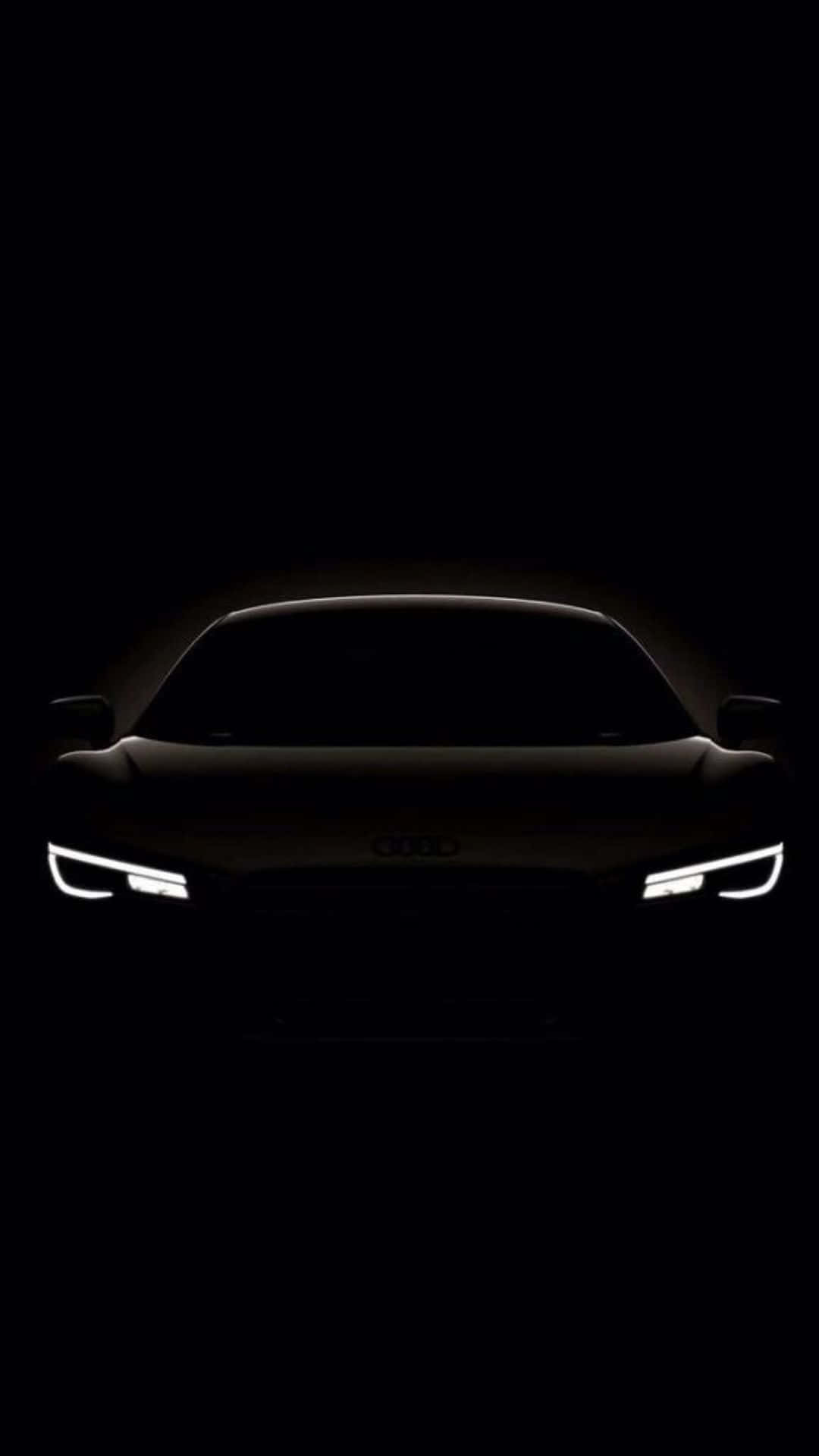 Black And White Car 桌布 壁紙 — Audi 汽車剪影在純黑背景上閃爍著銳利的車頭燈。