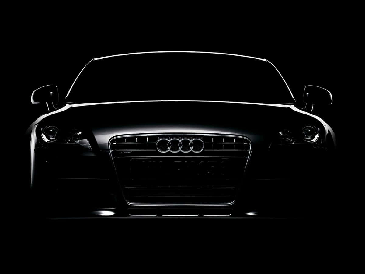 奧迪 桌布 壁紙 — Audi 跑車正面輪廓在純黑背景上閃爍著銳利的白色亮點。